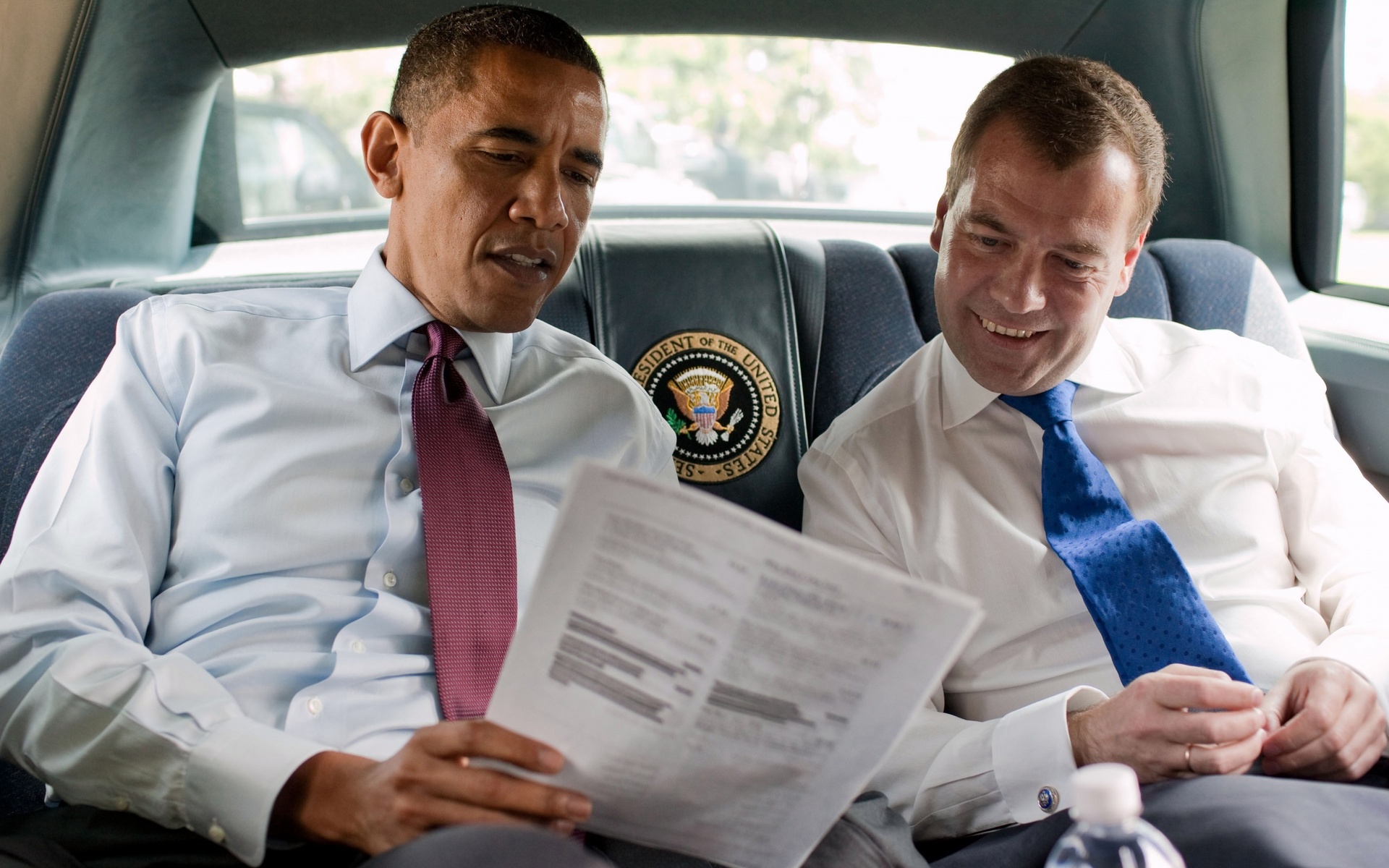 Barack Obama and Dmitry Medvedev in a car HD Wallpaper