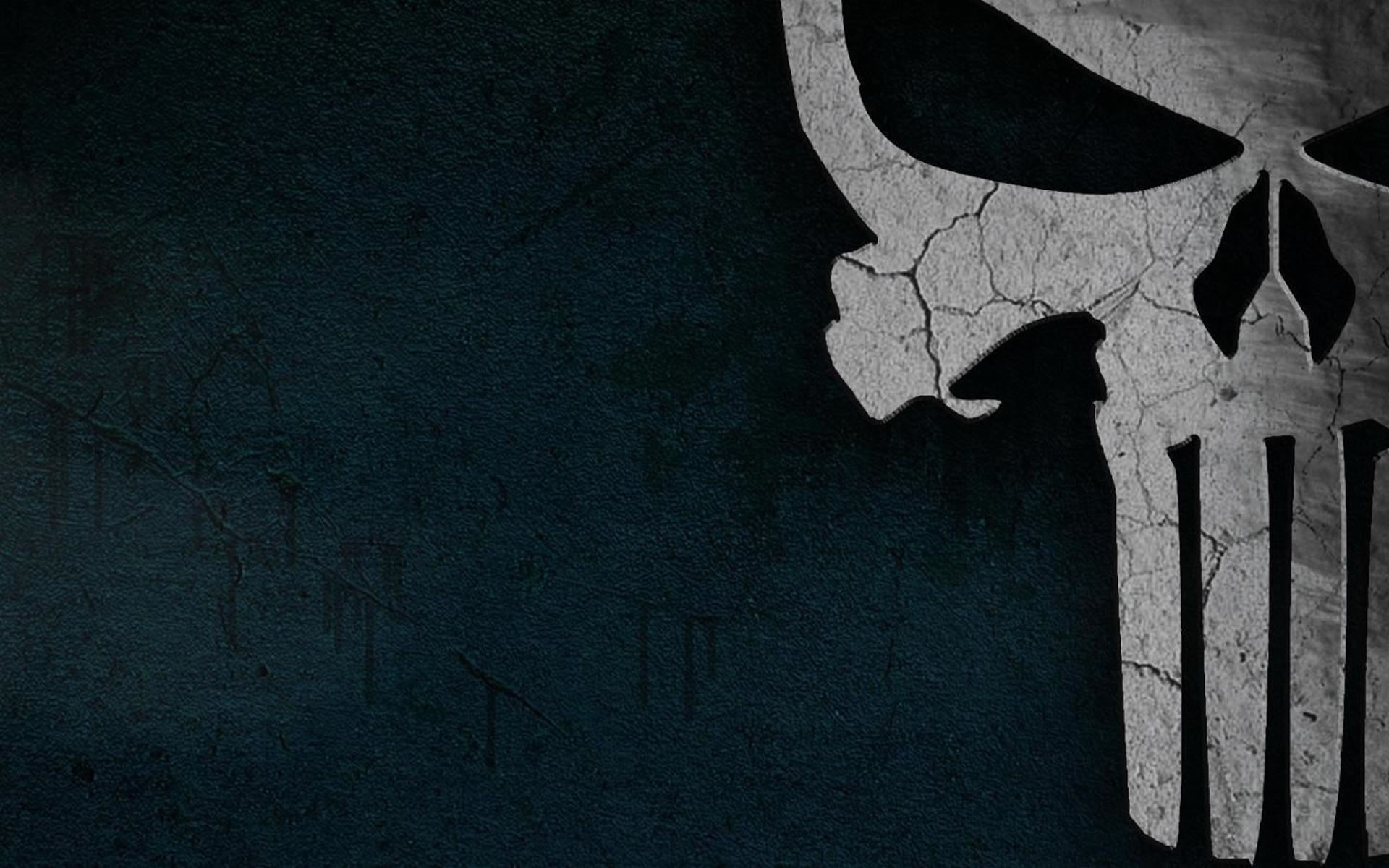 The Punisher skull logo on a dark background HD Wallpaper