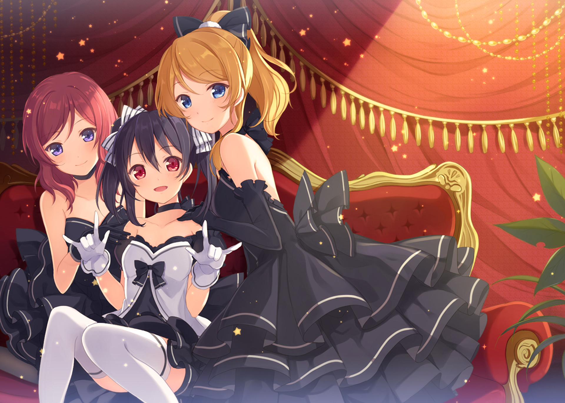 Three girls in black dresses on a red couch HD Wallpaper