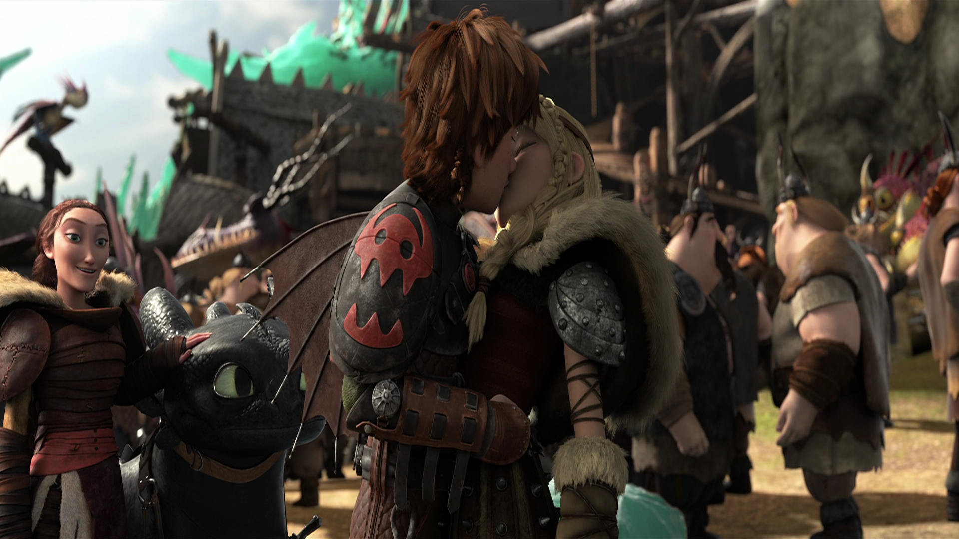 Hiccup and Astrid kiss in front of Toothless and a crowd HD Wallpaper