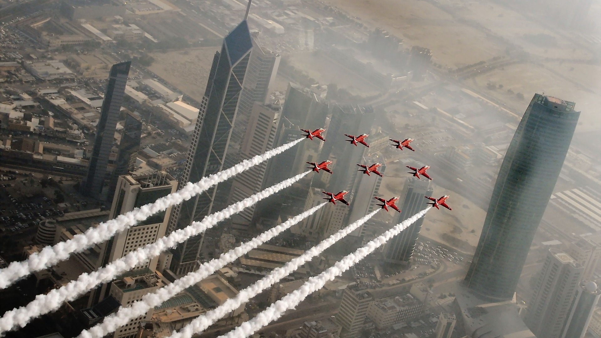 Red Arrows perform aerial display over Kuwait City skyscrapers HD Wallpaper