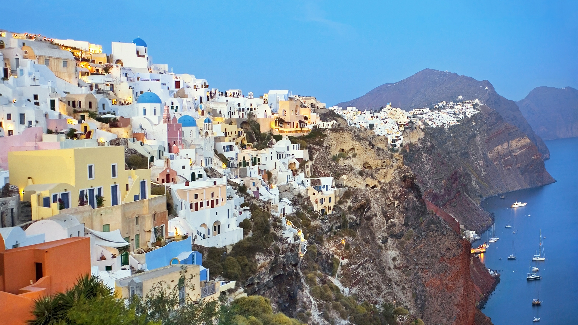 Oia, Santorini, Greece cliffside village with blue domed churches HD Wallpaper