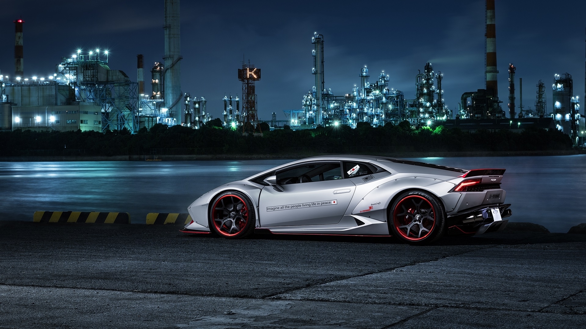 Silver Lamborghini Huracan with red accents at industrial complex HD Wallpaper