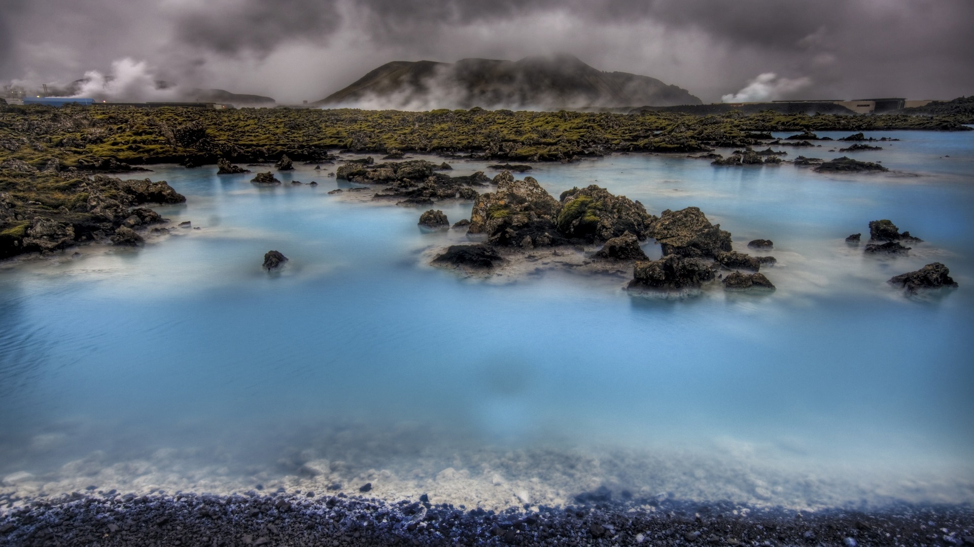 Blue Lagoon geothermal spa with volcanic rocks and steam HD Wallpaper