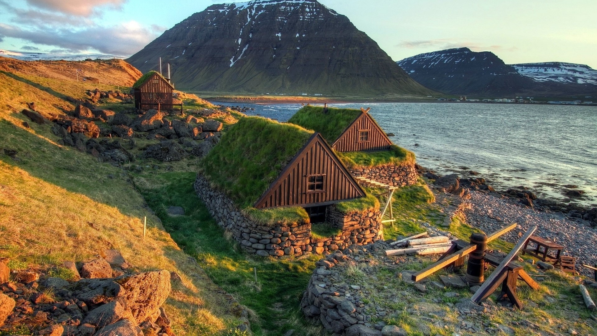 Traditional turf houses by the water in Iceland HD Wallpaper