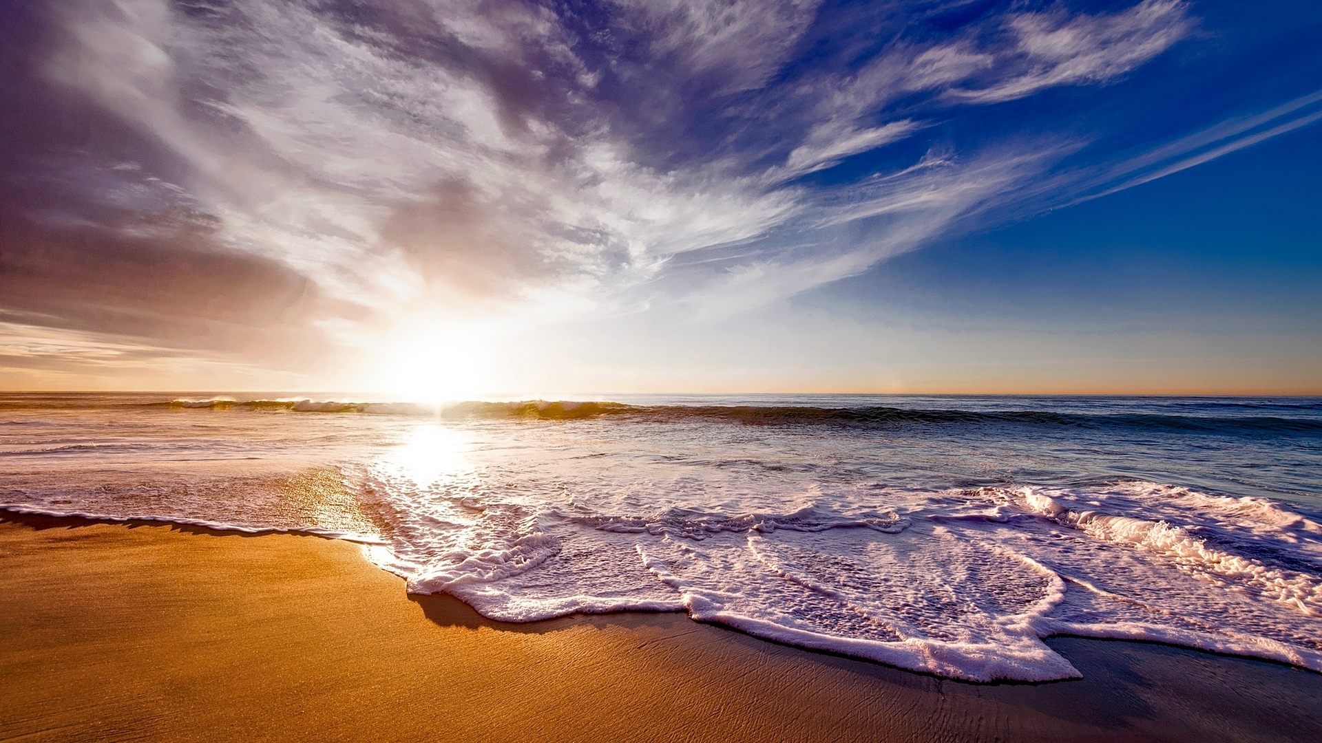 Sunset over the ocean with waves and clouds HD Wallpaper