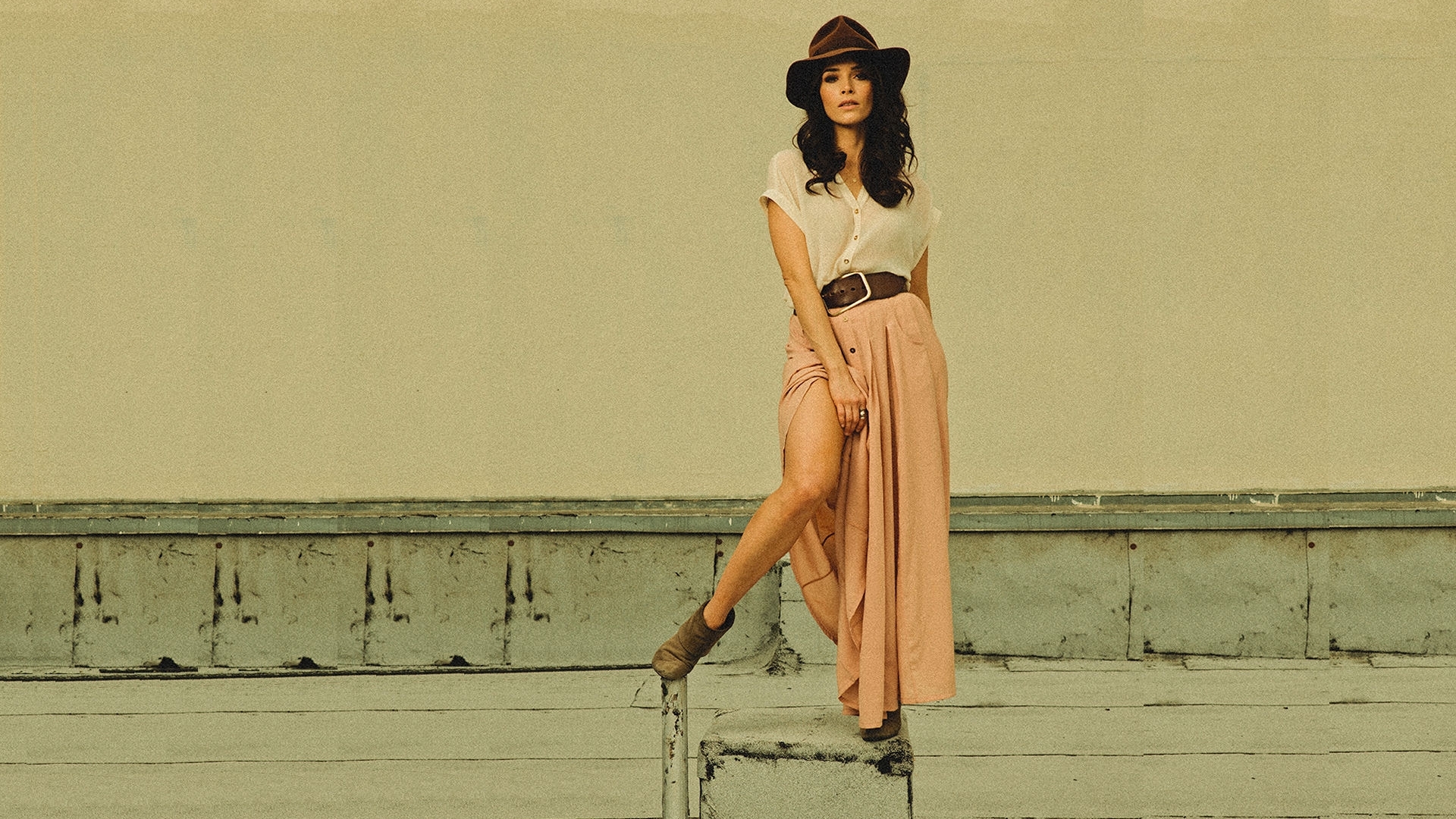 Woman in hat and skirt posing outdoors HD Wallpaper