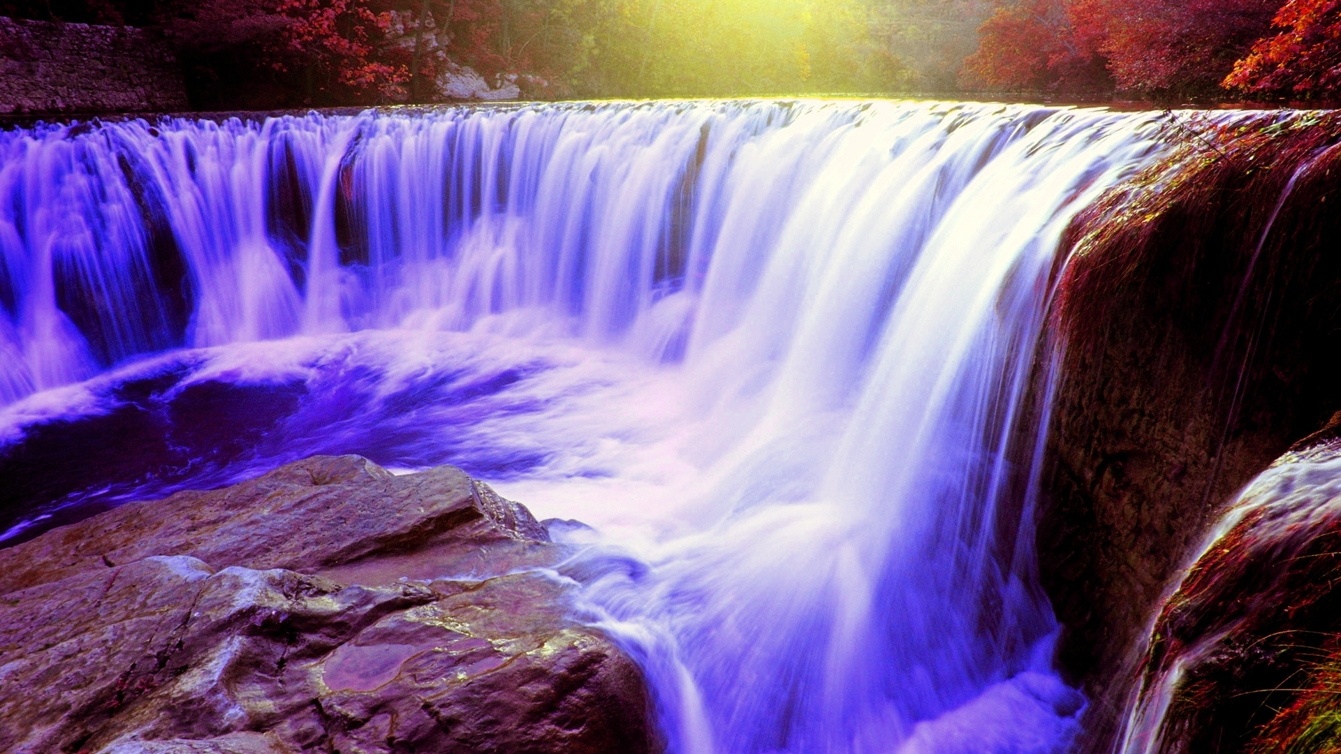 Waterfall in autumn forest with sunlight HD Wallpaper