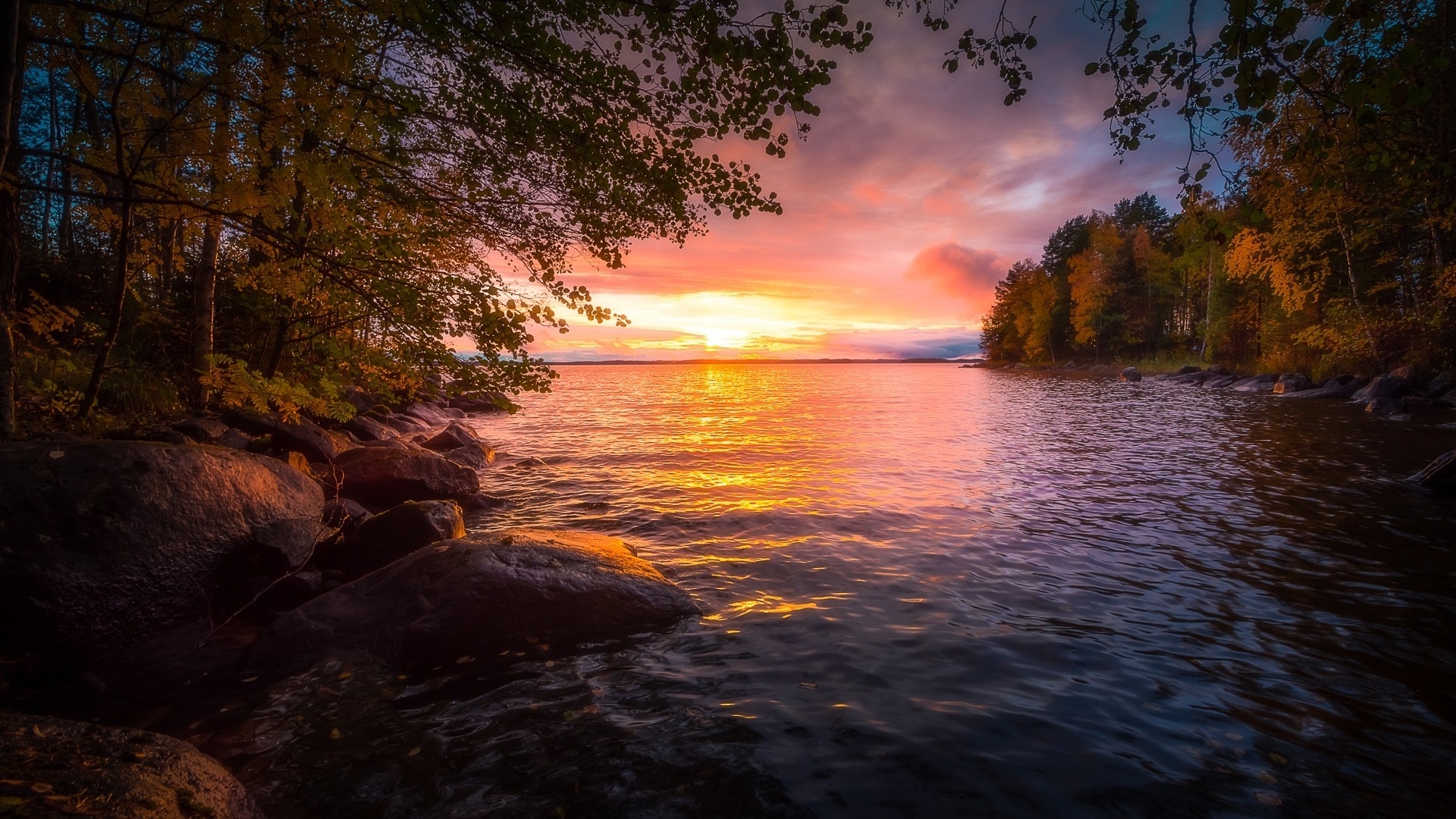 Autumn sunset over a lake with trees and rocks HD Wallpaper