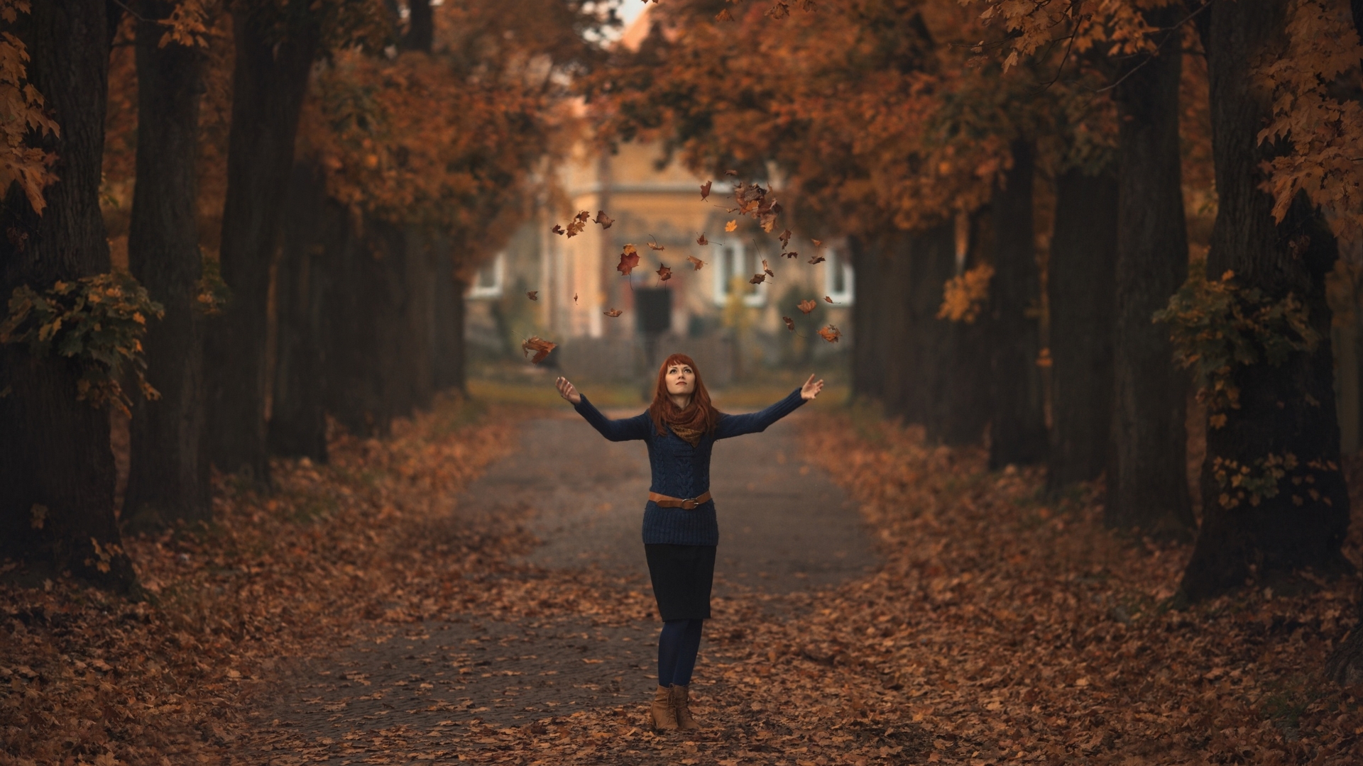 Woman throwing leaves in autumn park HD Wallpaper