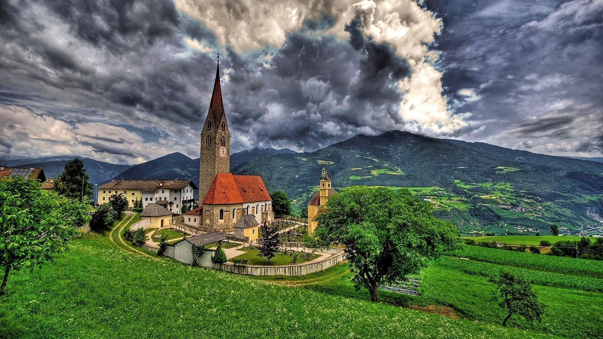 Church and village in the Italian Alps HD Wallpaper