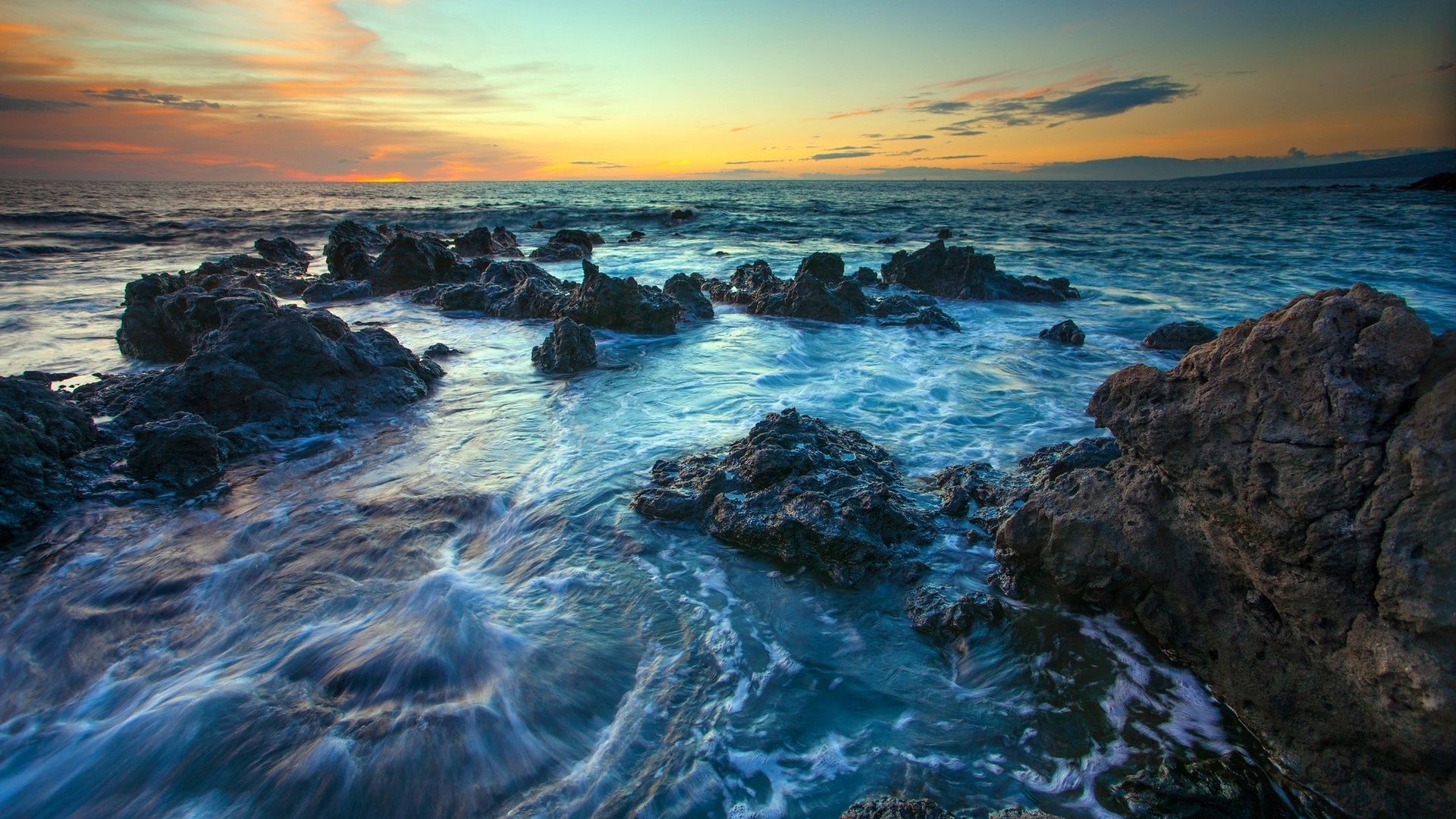 Rocky Beach at Sunset with Vibrant Sky HD Wallpaper