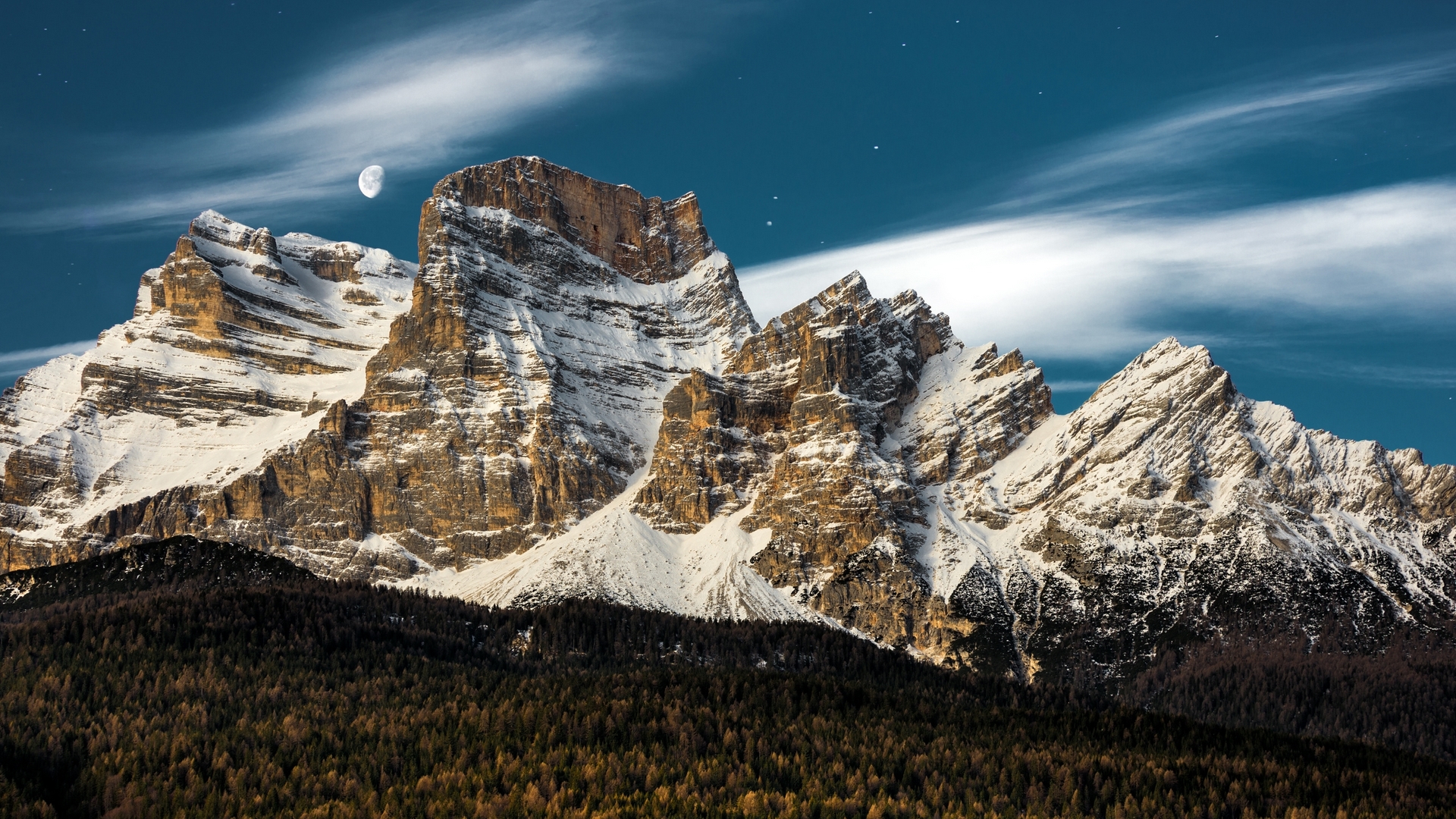 Snow-capped mountains under a starry sky with moon HD Wallpaper