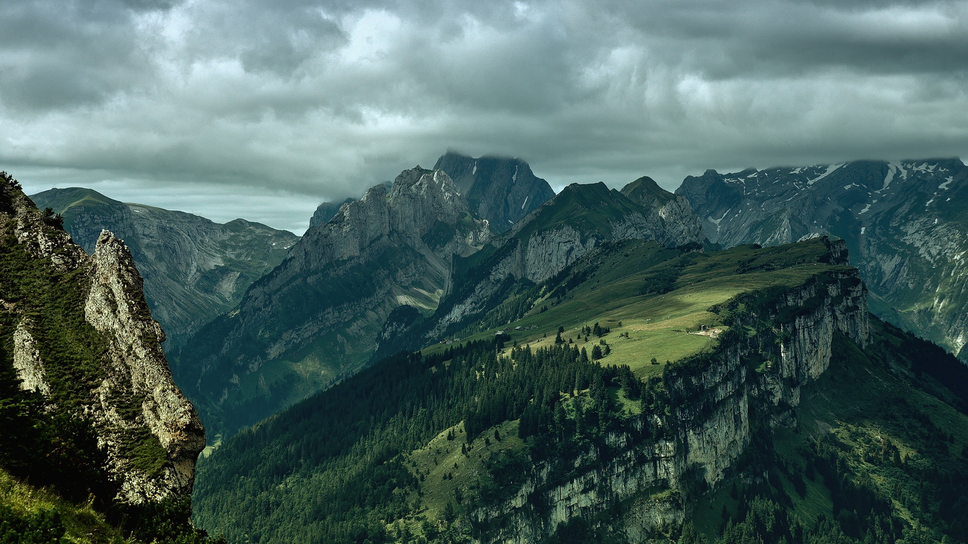 Dramatic mountain landscape under cloudy sky HD Wallpaper