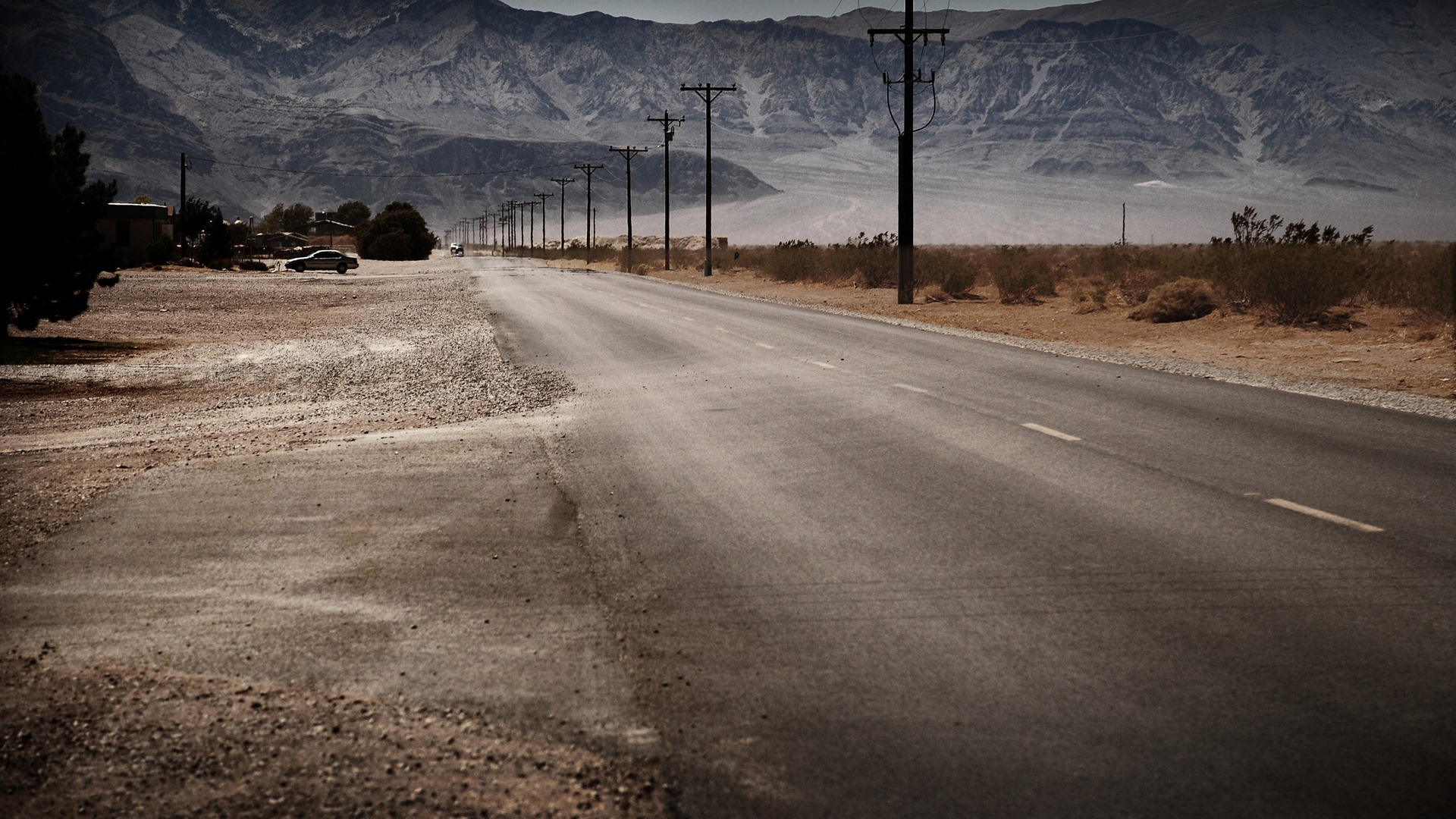 Desert Road Stretching into Mountain Horizon HD Wallpaper