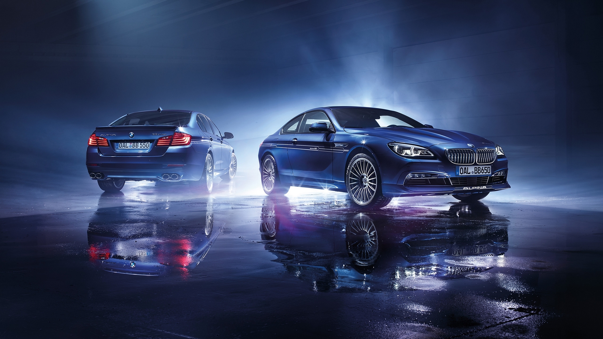 Two blue Alpina BMW cars on wet ground HD Wallpaper