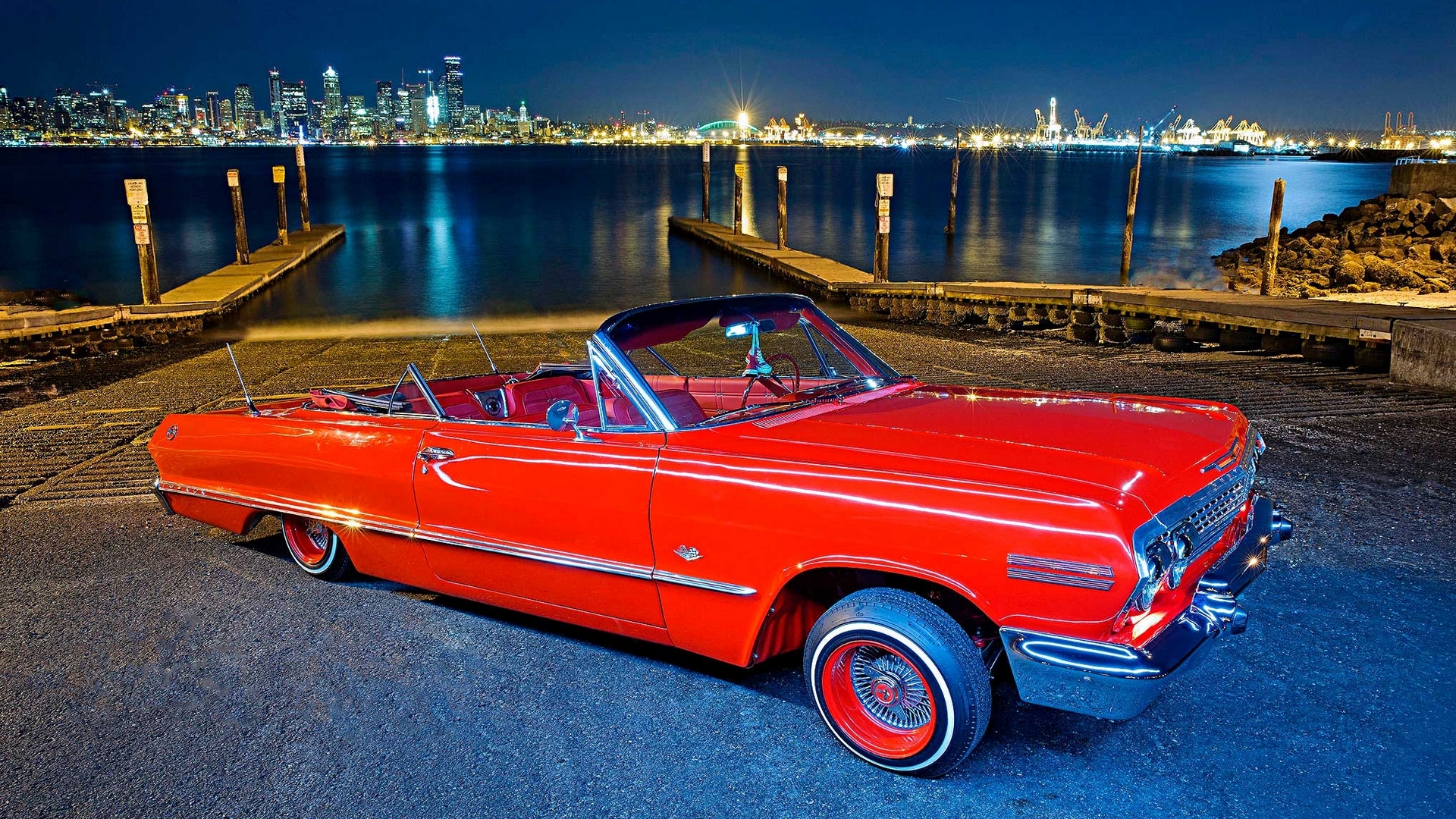 Red classic convertible car by the water at night HD Wallpaper