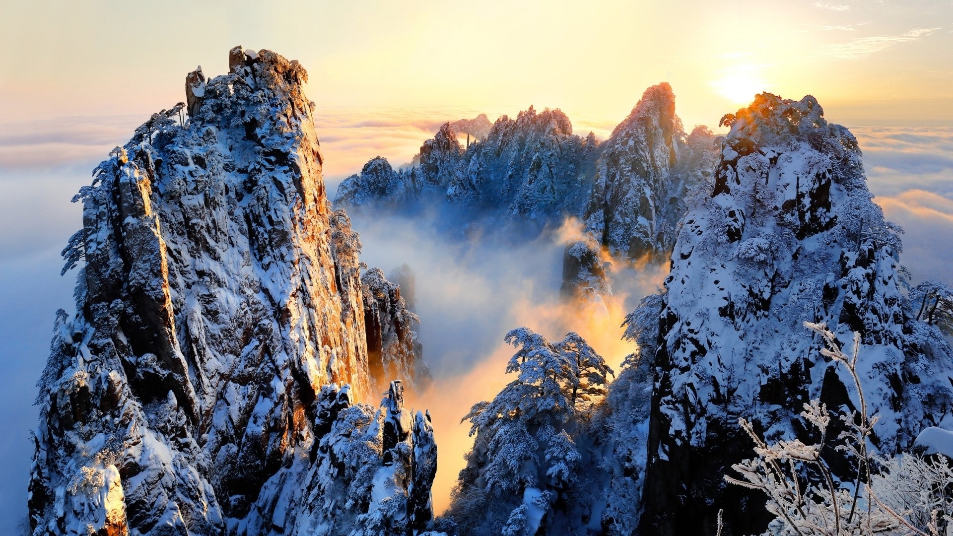 Snow-covered mountains at sunrise with clouds HD Wallpaper