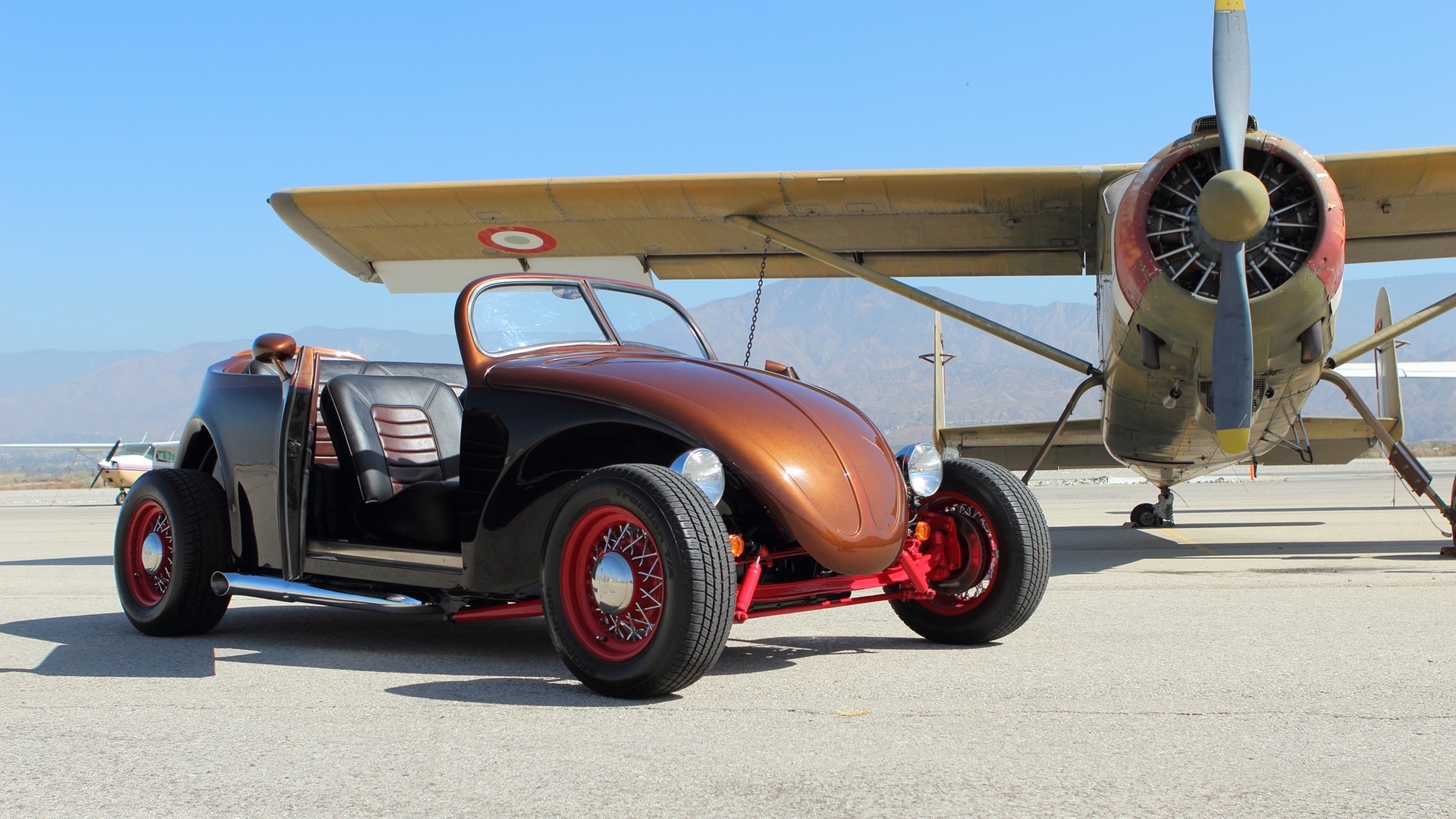 Custom VW Beetle hot rod parked next to a vintage airplane HD Wallpaper
