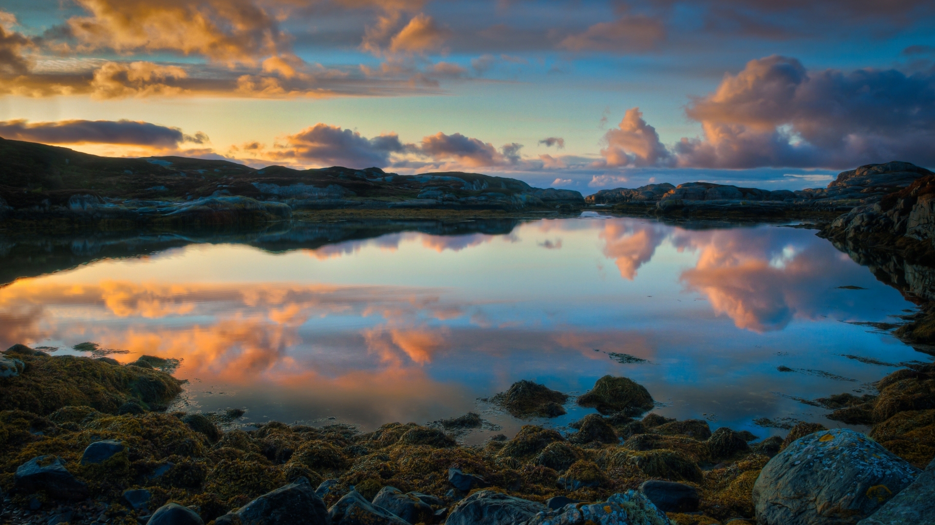 Sunset over rocky coast with reflections HD Wallpaper
