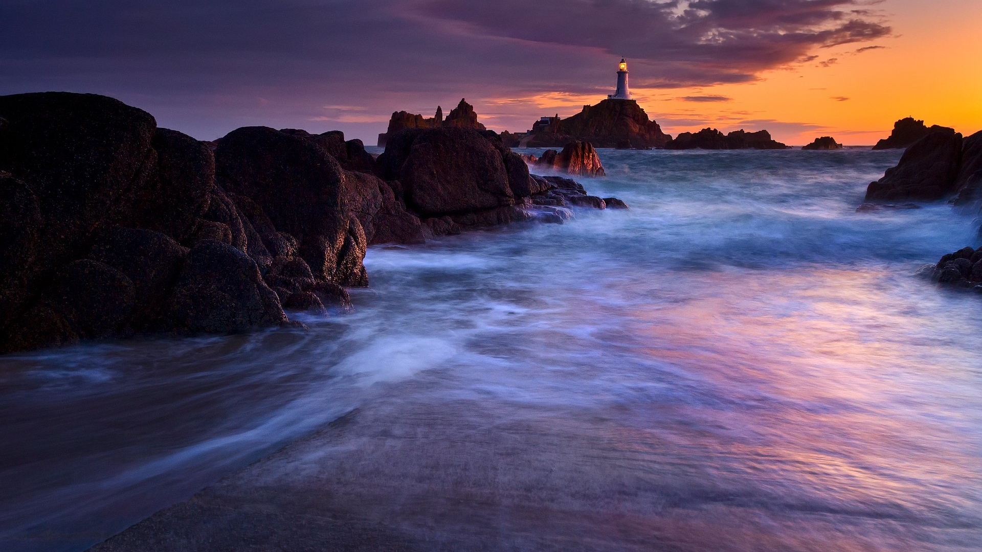 Calm Sea and Rocky Shore at Twilight Sunset HD Wallpaper