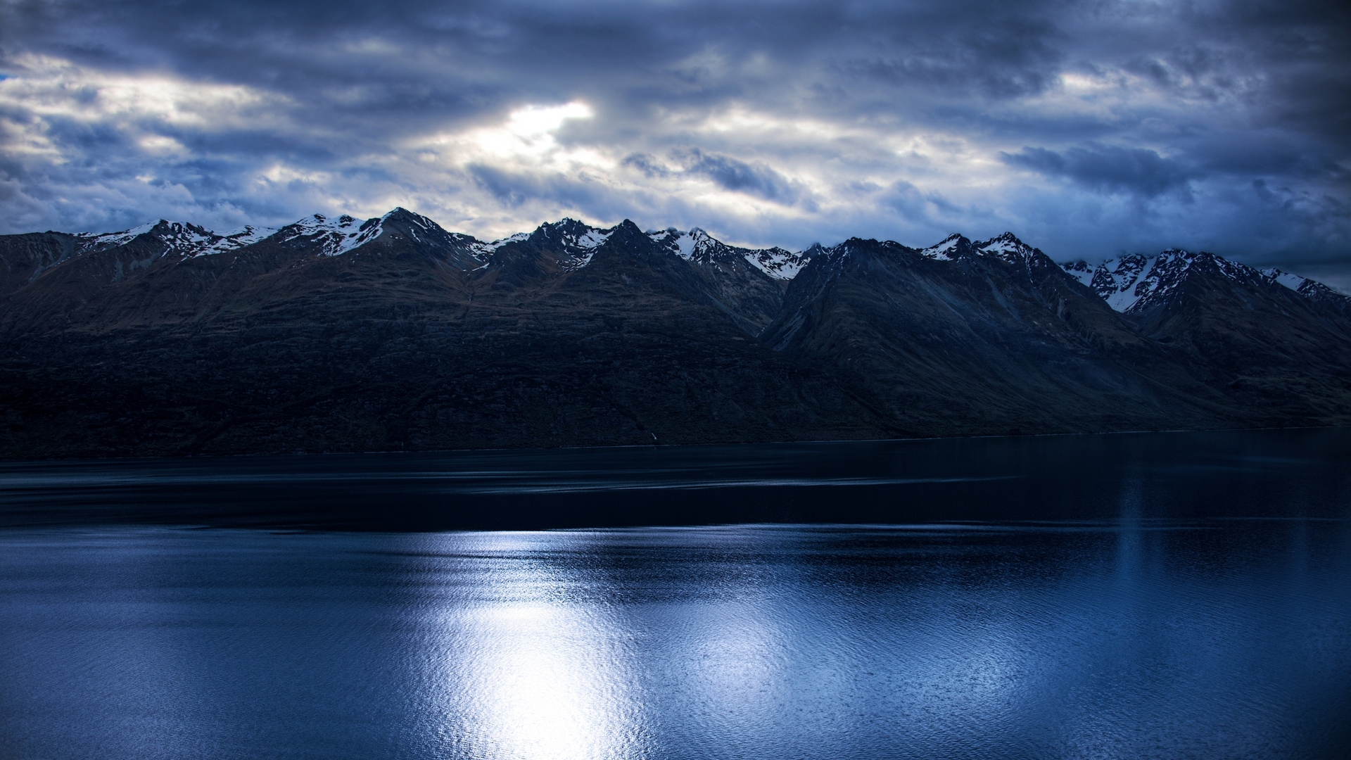 Calm Mountain Range with Blue Water and Cloudy Sky HD Wallpaper