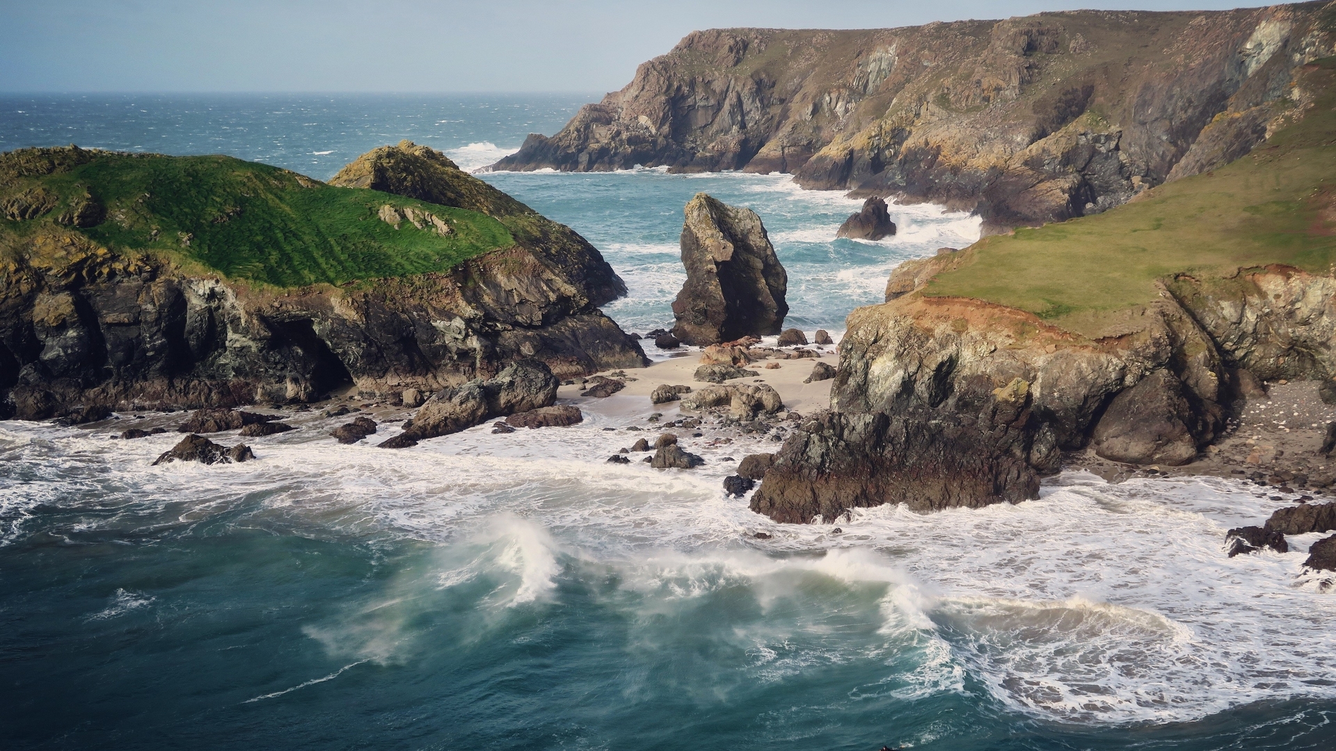 Rocky coastline with waves crashing on the shore HD Wallpaper