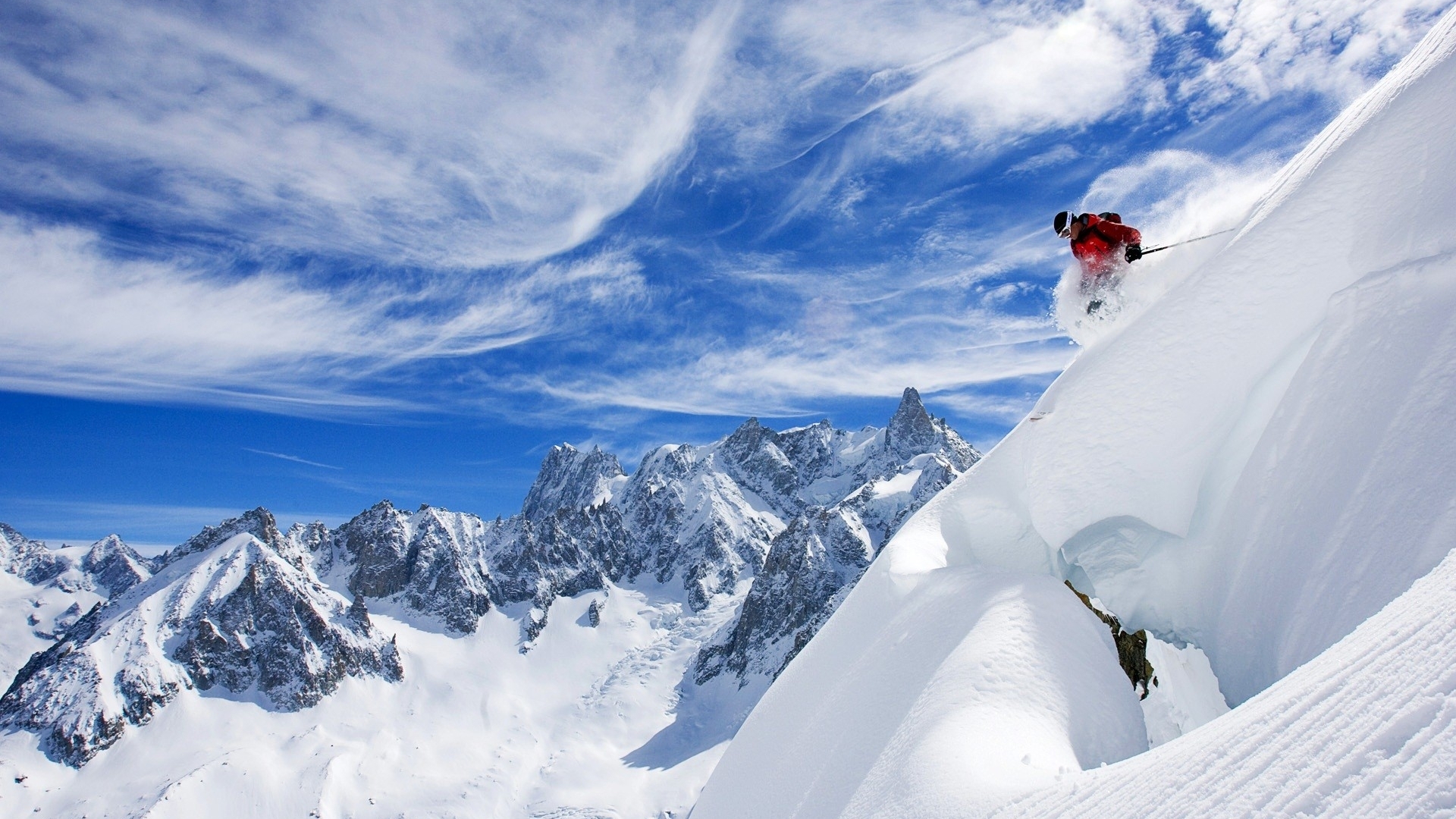 Skier skiing down a snowy mountain in France HD Wallpaper