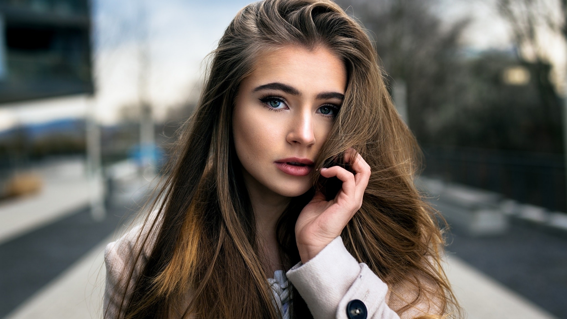 Woman with long brown hair and blue eyes HD Wallpaper