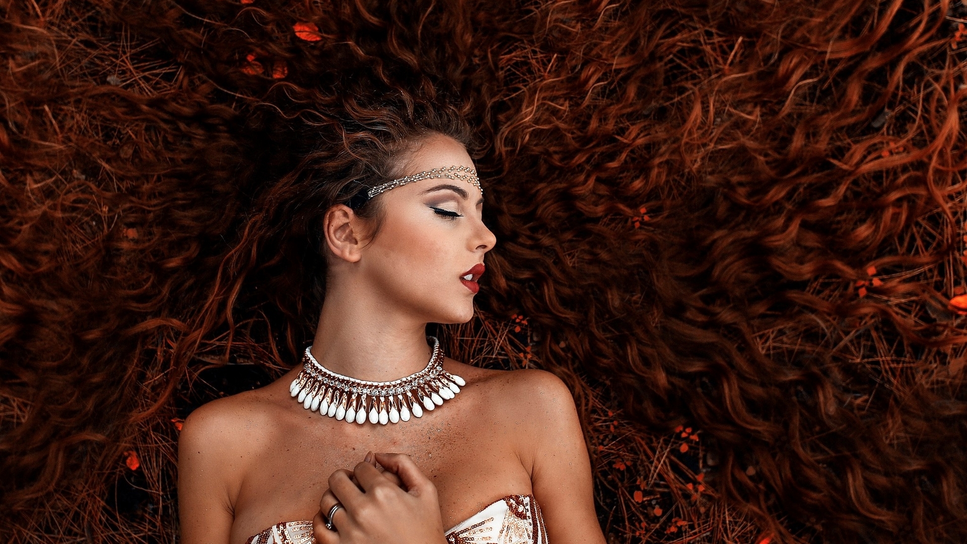 Woman with long curly red hair lying down HD Wallpaper
