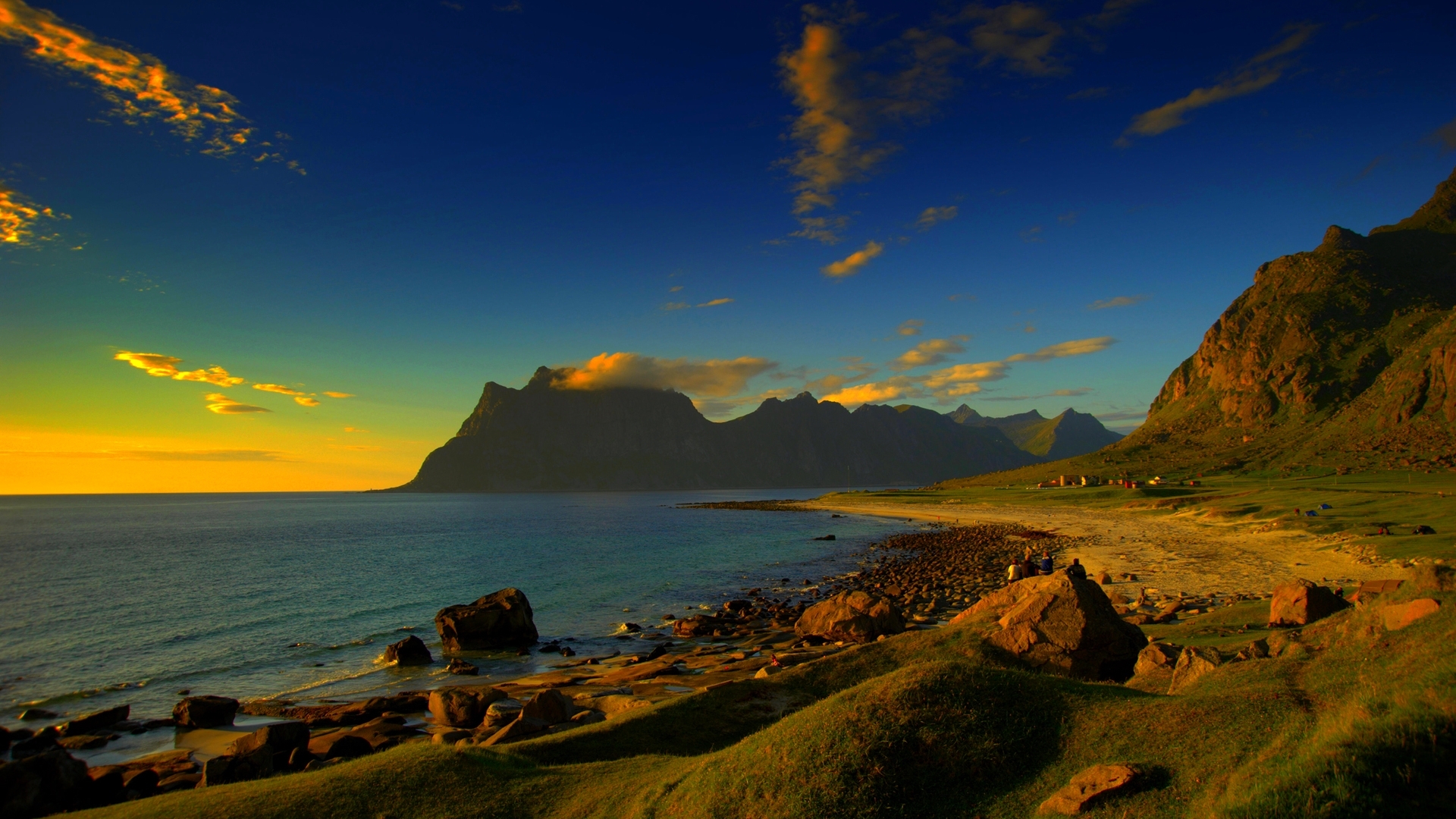 Rocky beach and mountains at sunset HD Wallpaper