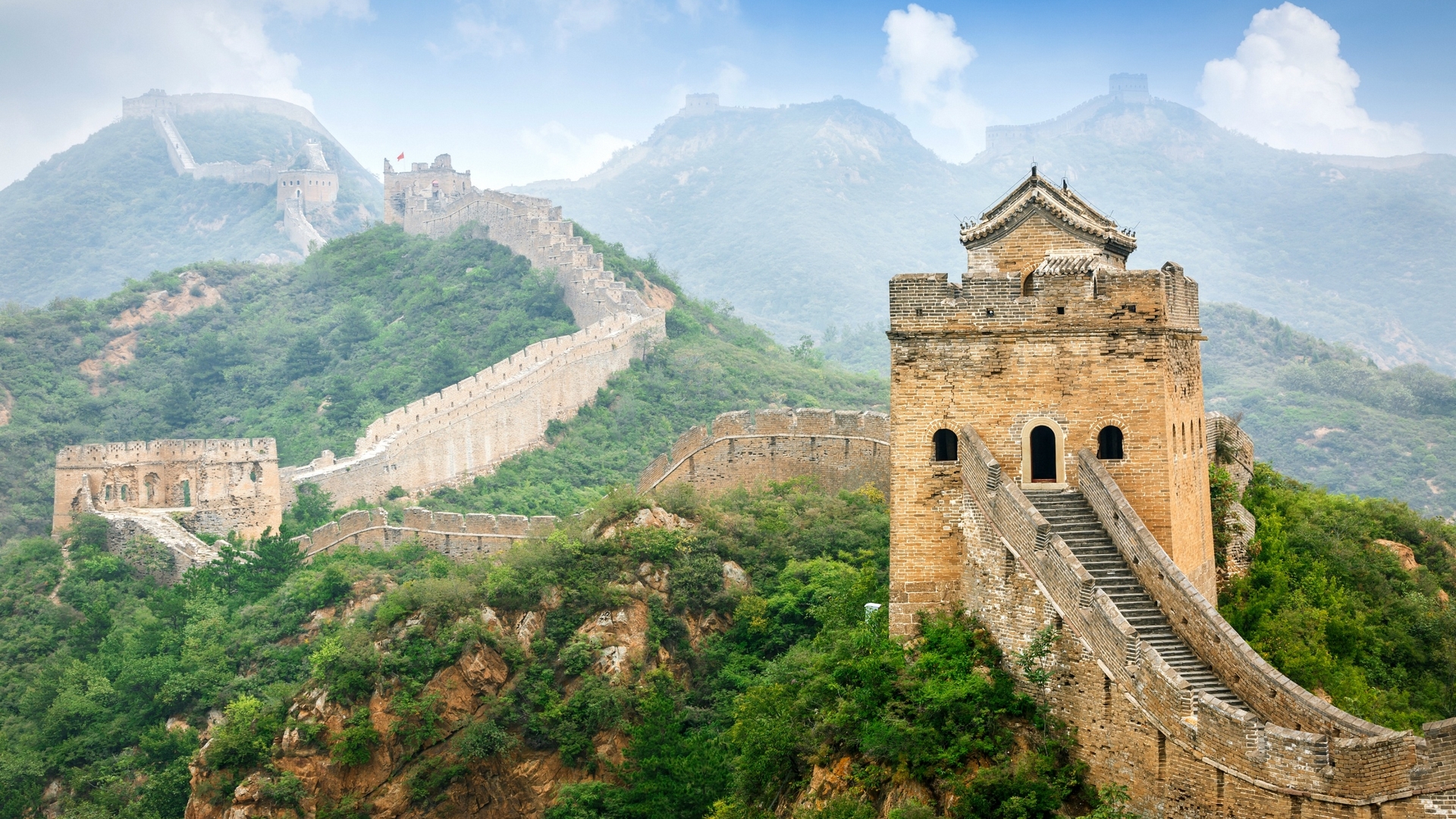 The Great Wall of China winding through misty mountains HD Wallpaper