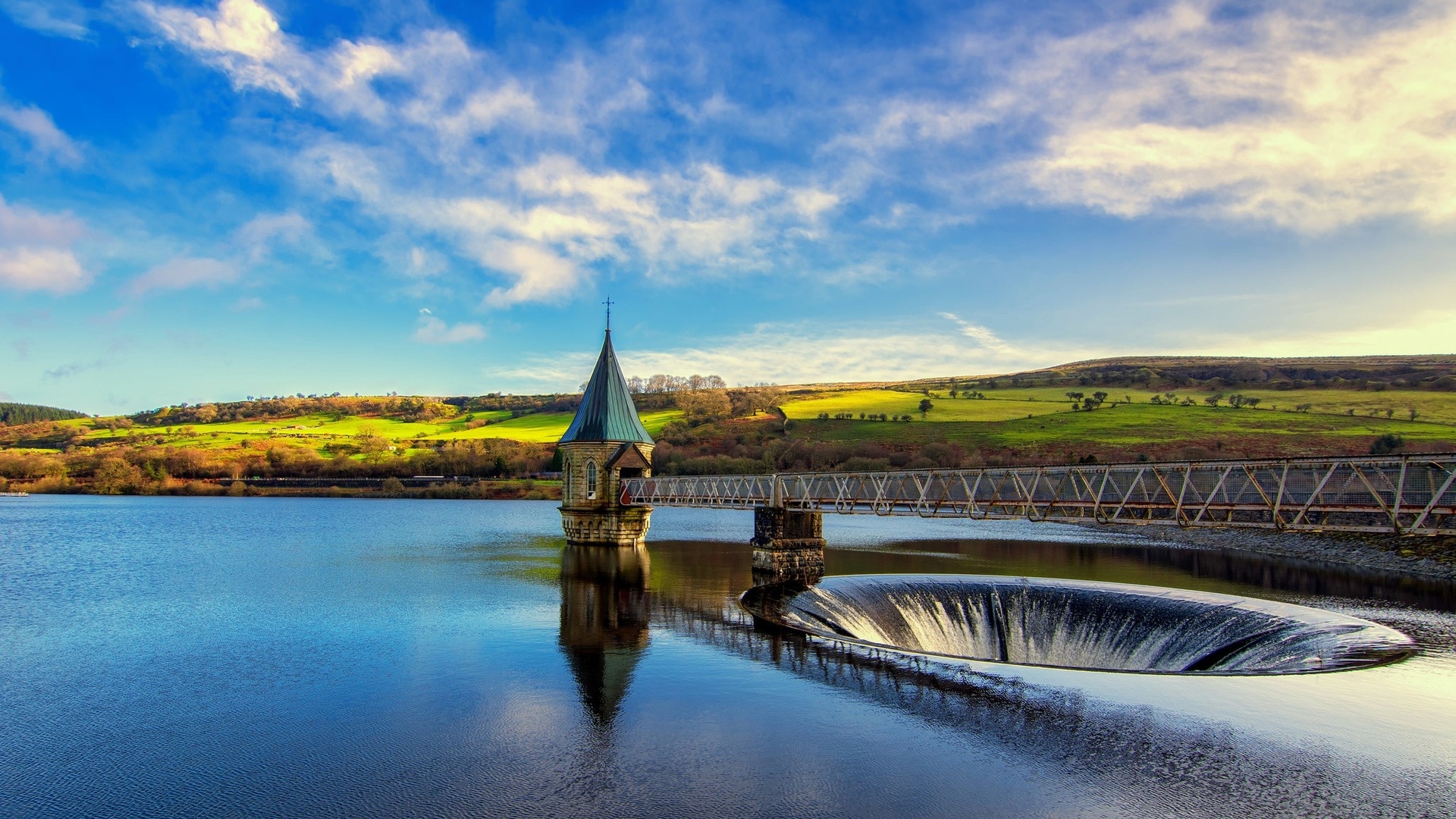 Reservoir with tower and overflow spillway HD Wallpaper