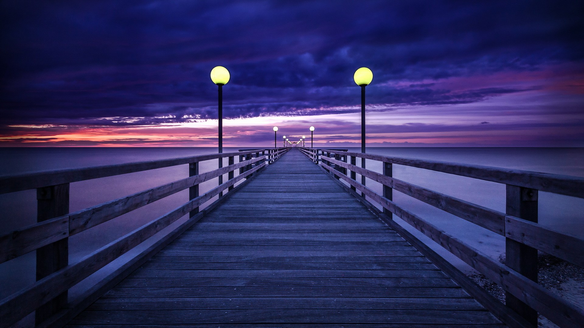 Wooden pier with lamps at sunset HD Wallpaper