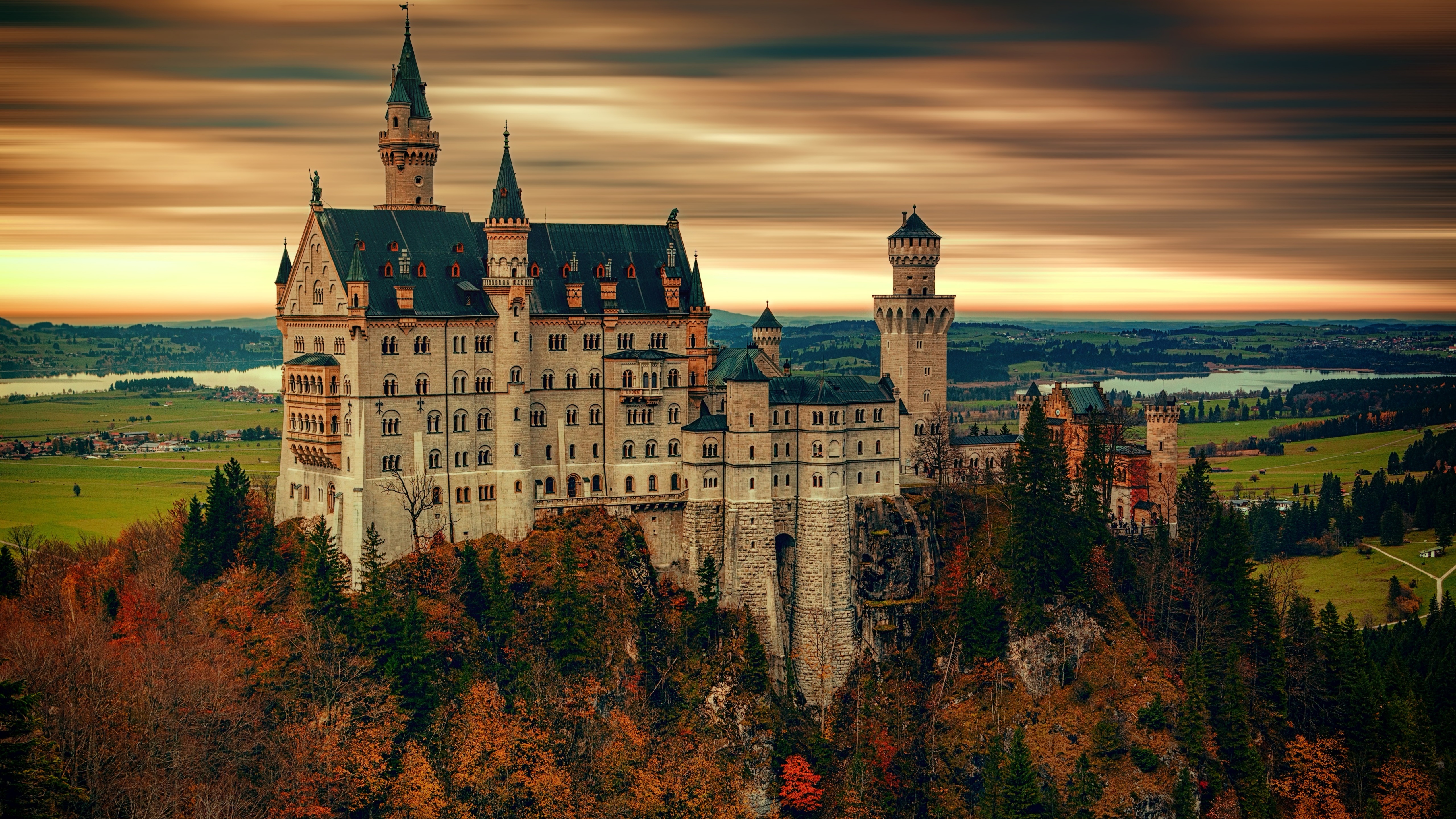 Neuschwanstein Castle on a hill during sunset HD Wallpaper