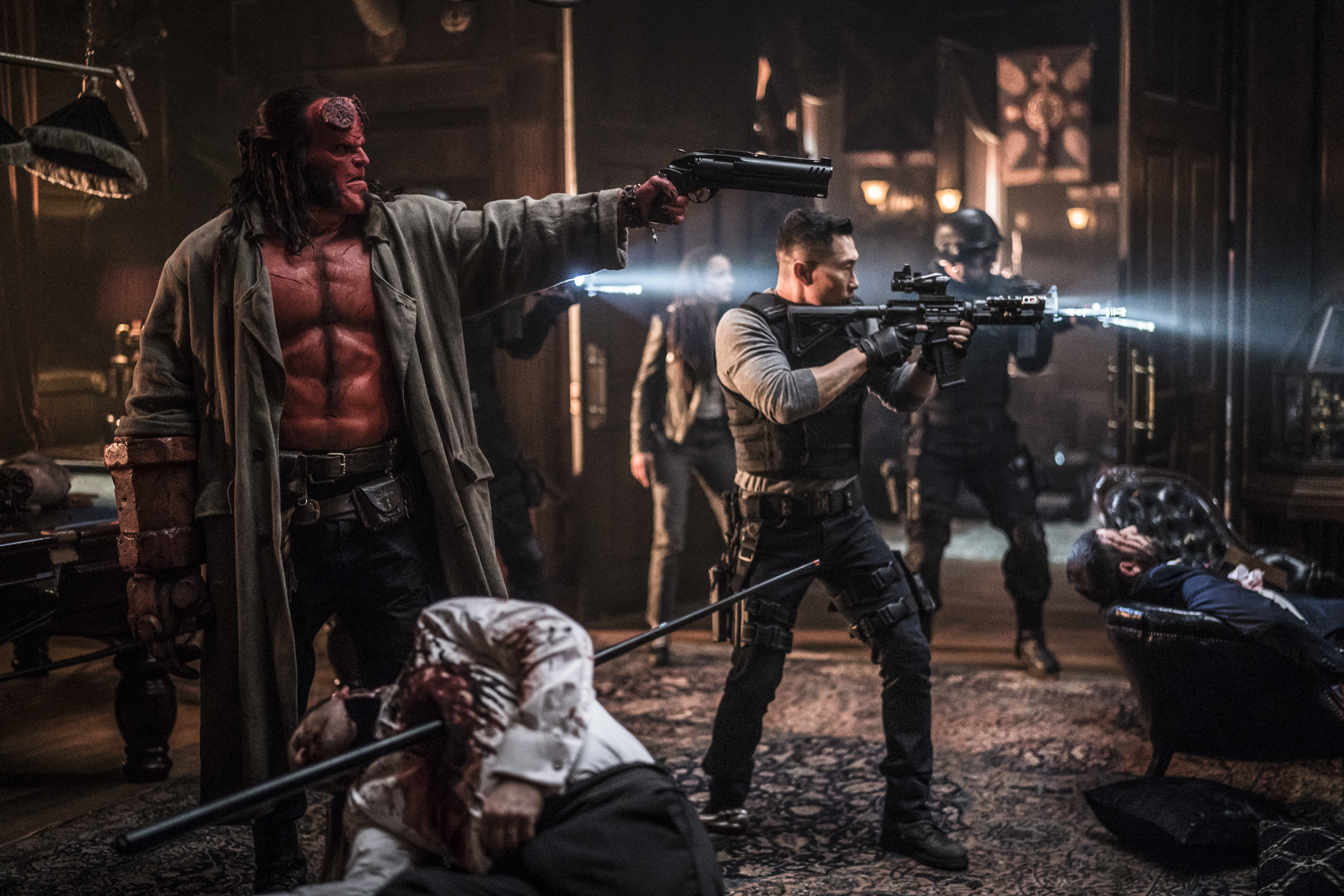 Hellboy and soldiers in a room HD Wallpaper