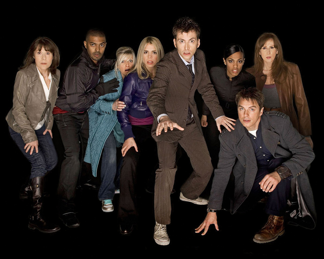 Doctor Who cast posing against a black background HD Wallpaper
