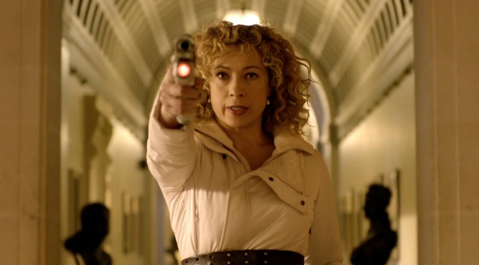 River Song from Doctor Who holding a gun HD Wallpaper