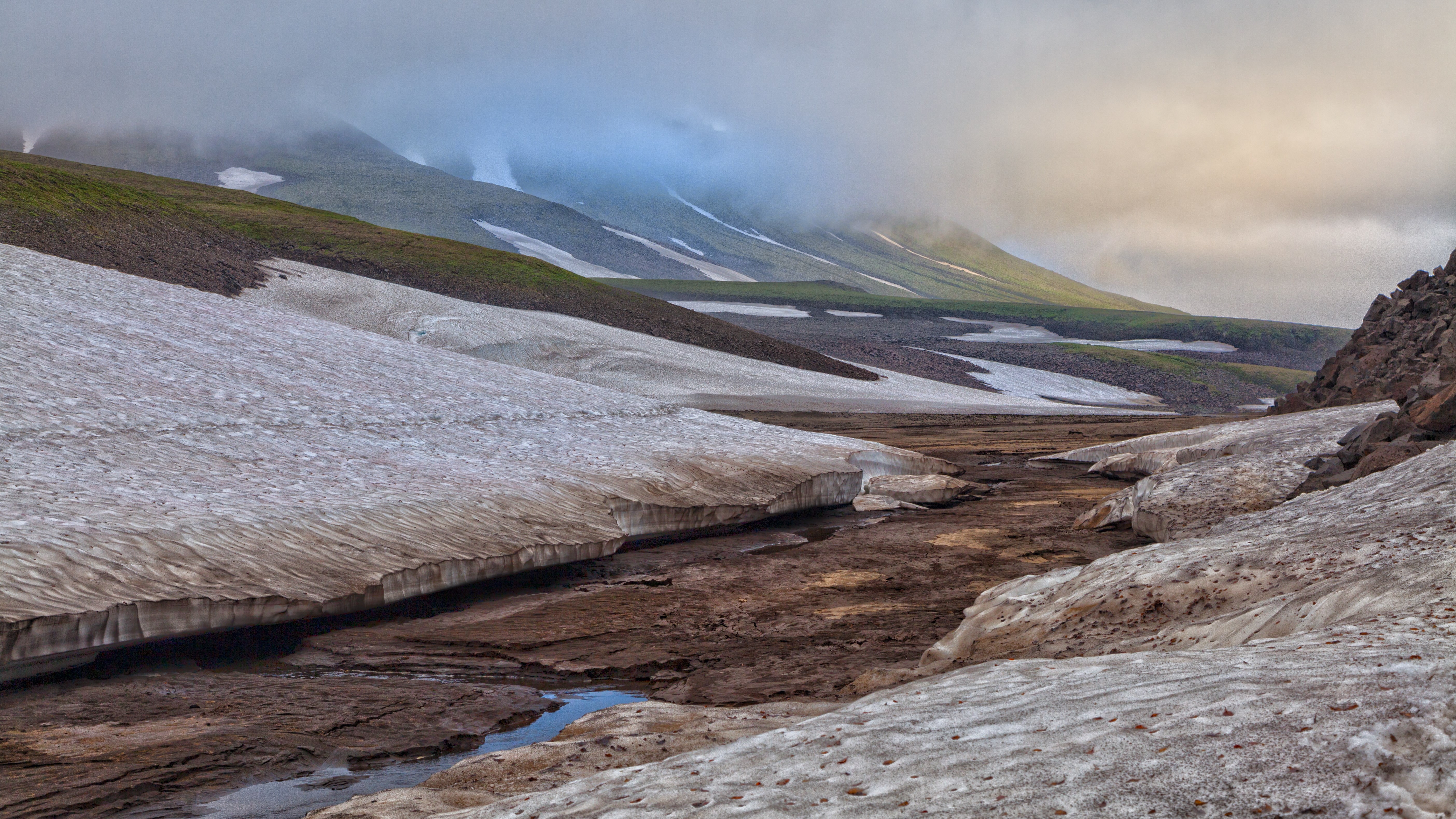 Snowy mountain landscape with a stream HD Wallpaper