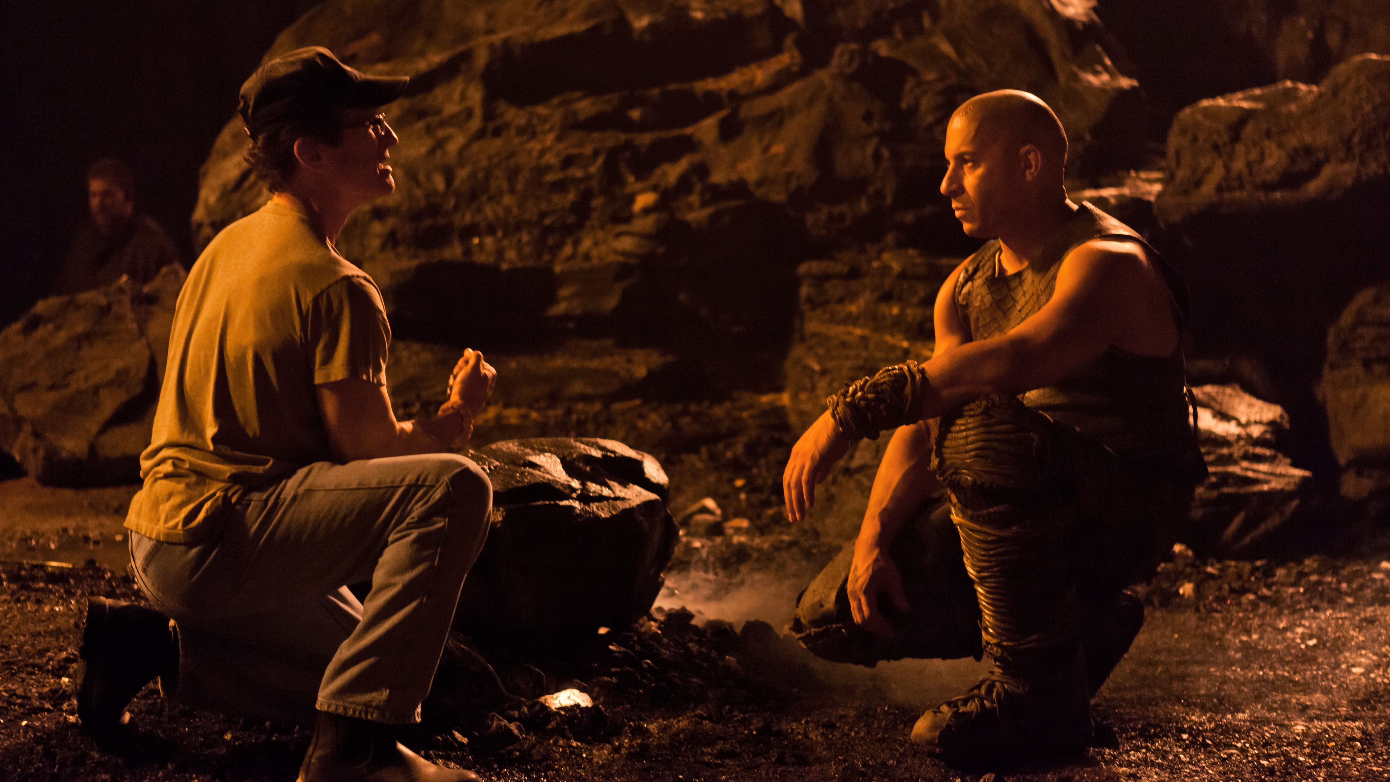 Riddick and another man in a cave HD Wallpaper