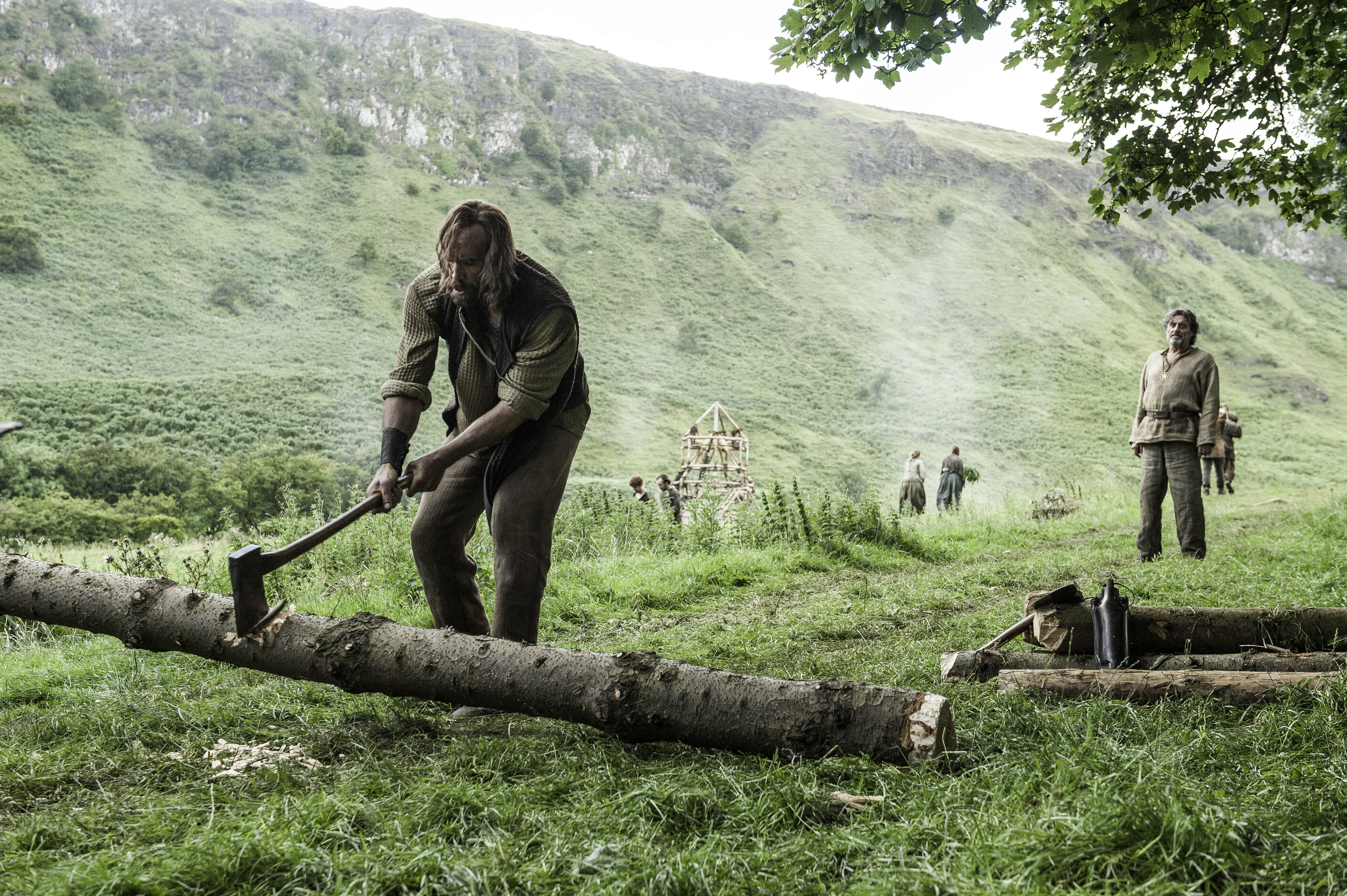 Sandor Clegane chopping wood in a valley HD Wallpaper