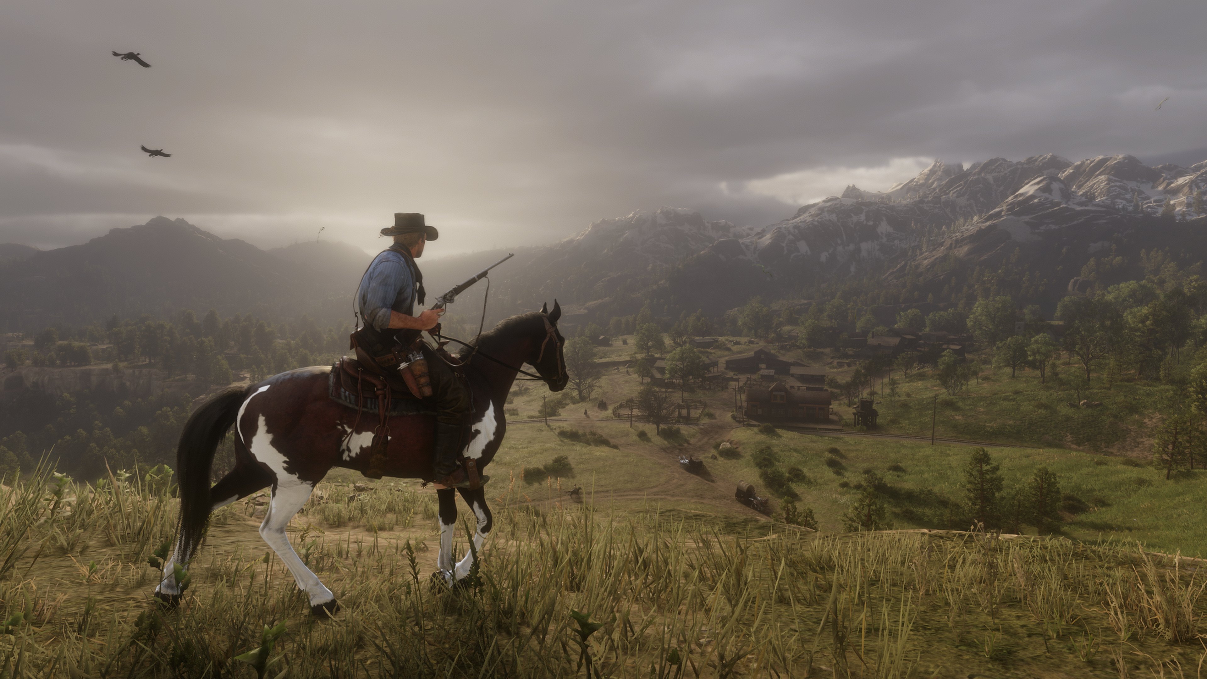 Arthur Morgan on horseback overlooking a valley HD Wallpaper