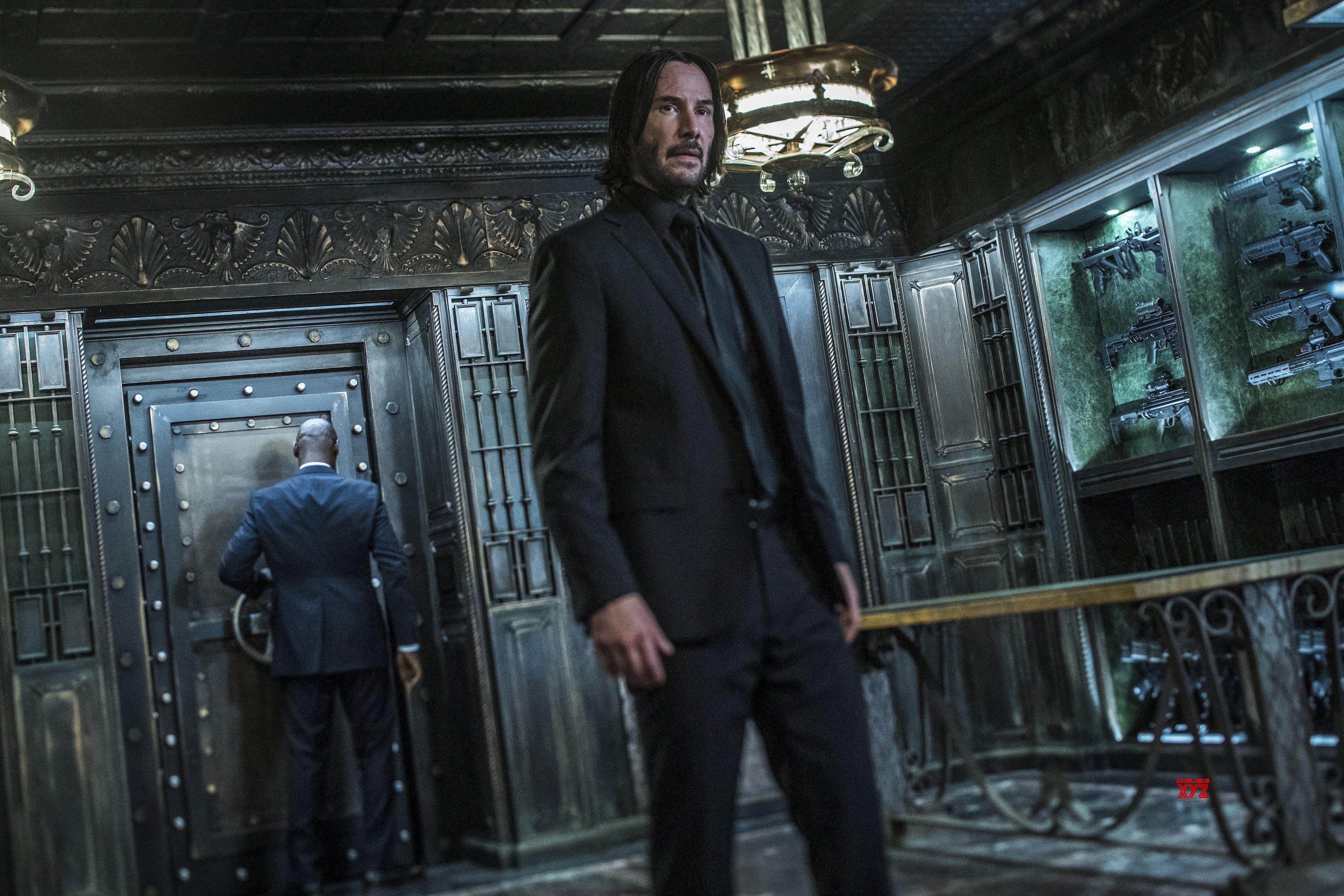 John Wick in a vault with guns HD Wallpaper