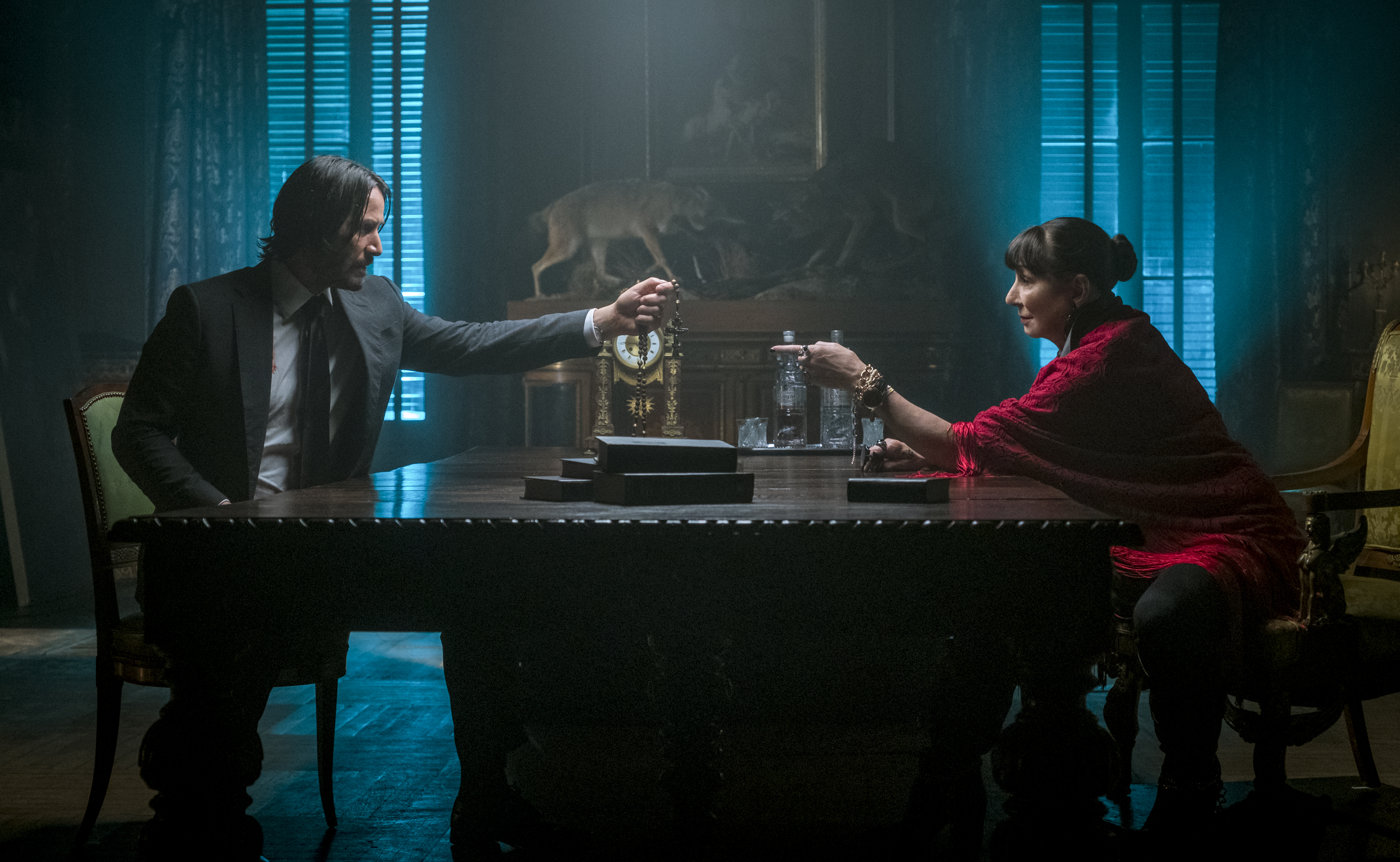 John Wick and Sofia at a table HD Wallpaper
