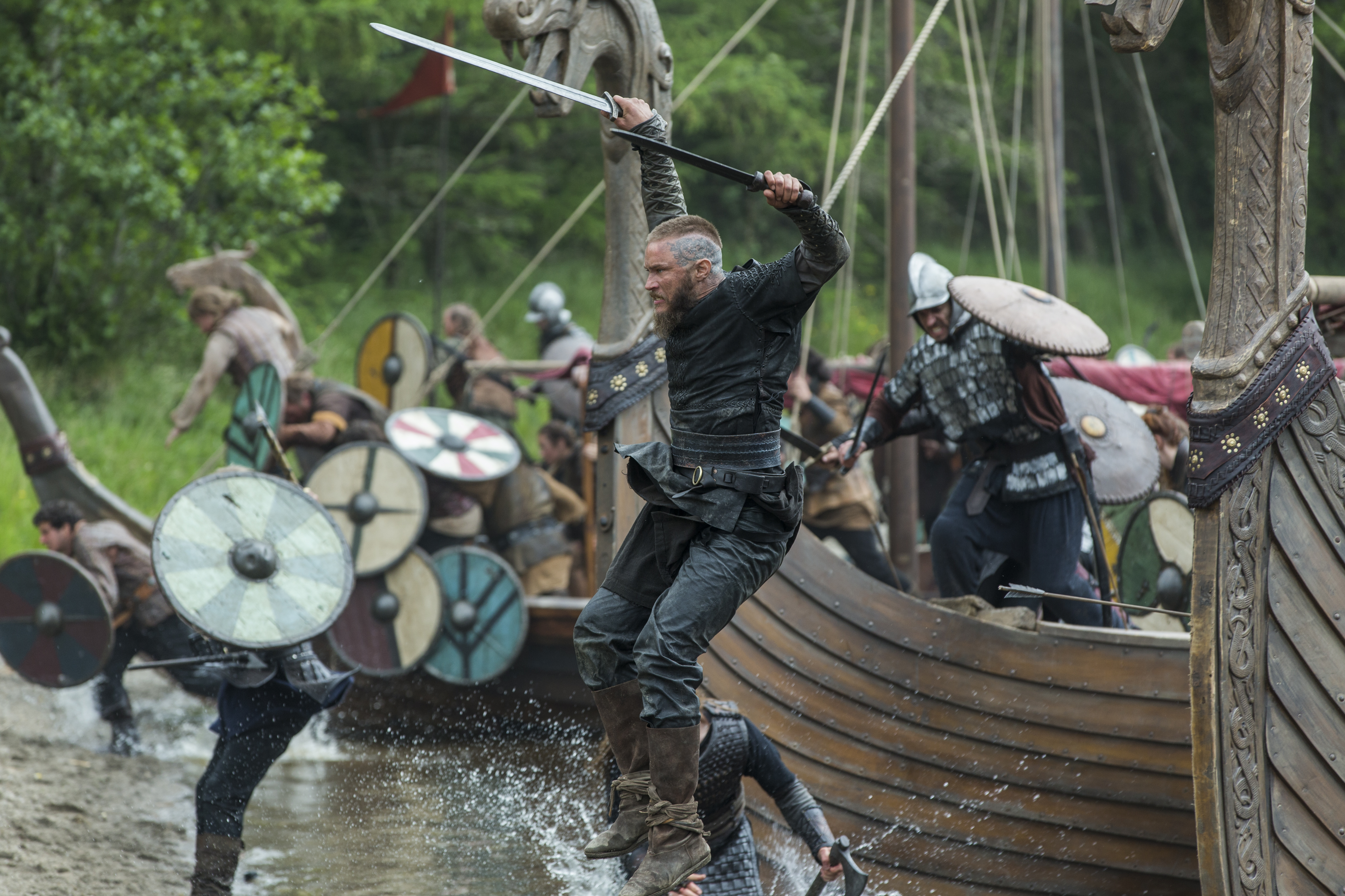 Ragnar Lothbrok jumping from a Viking ship HD Wallpaper