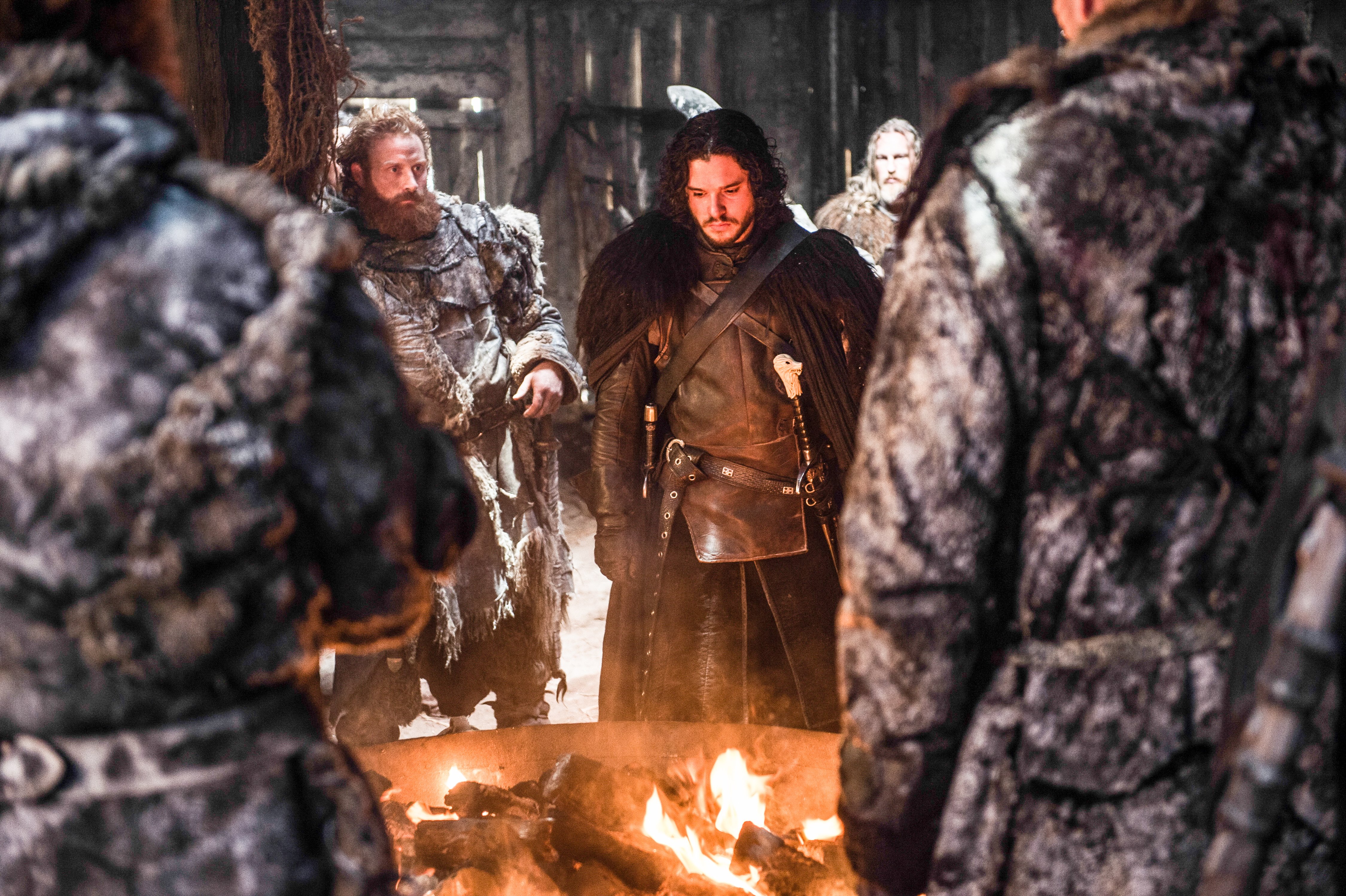 Tormund Giantsbane and Jon Snow by a campfire HD Wallpaper