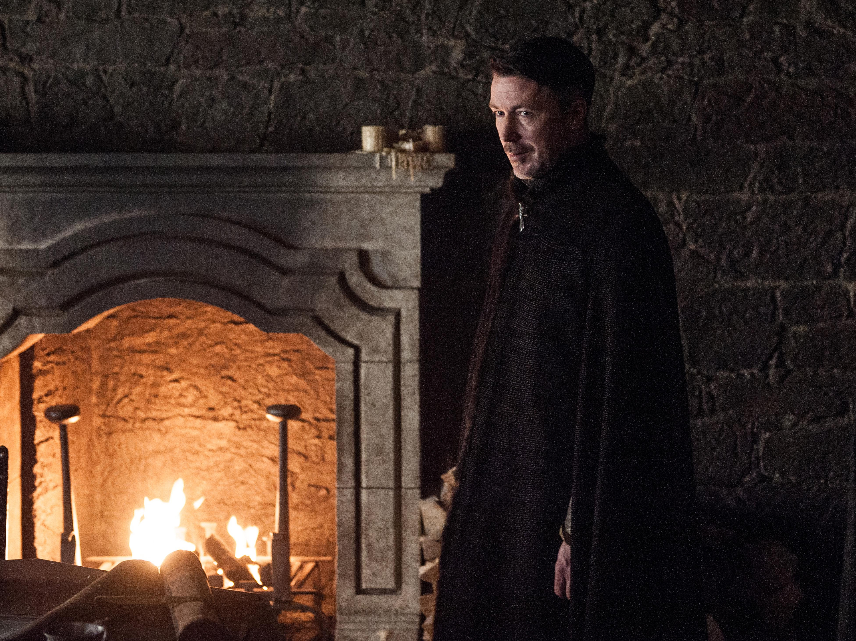 Petyr Baelish in front of a fireplace HD Wallpaper