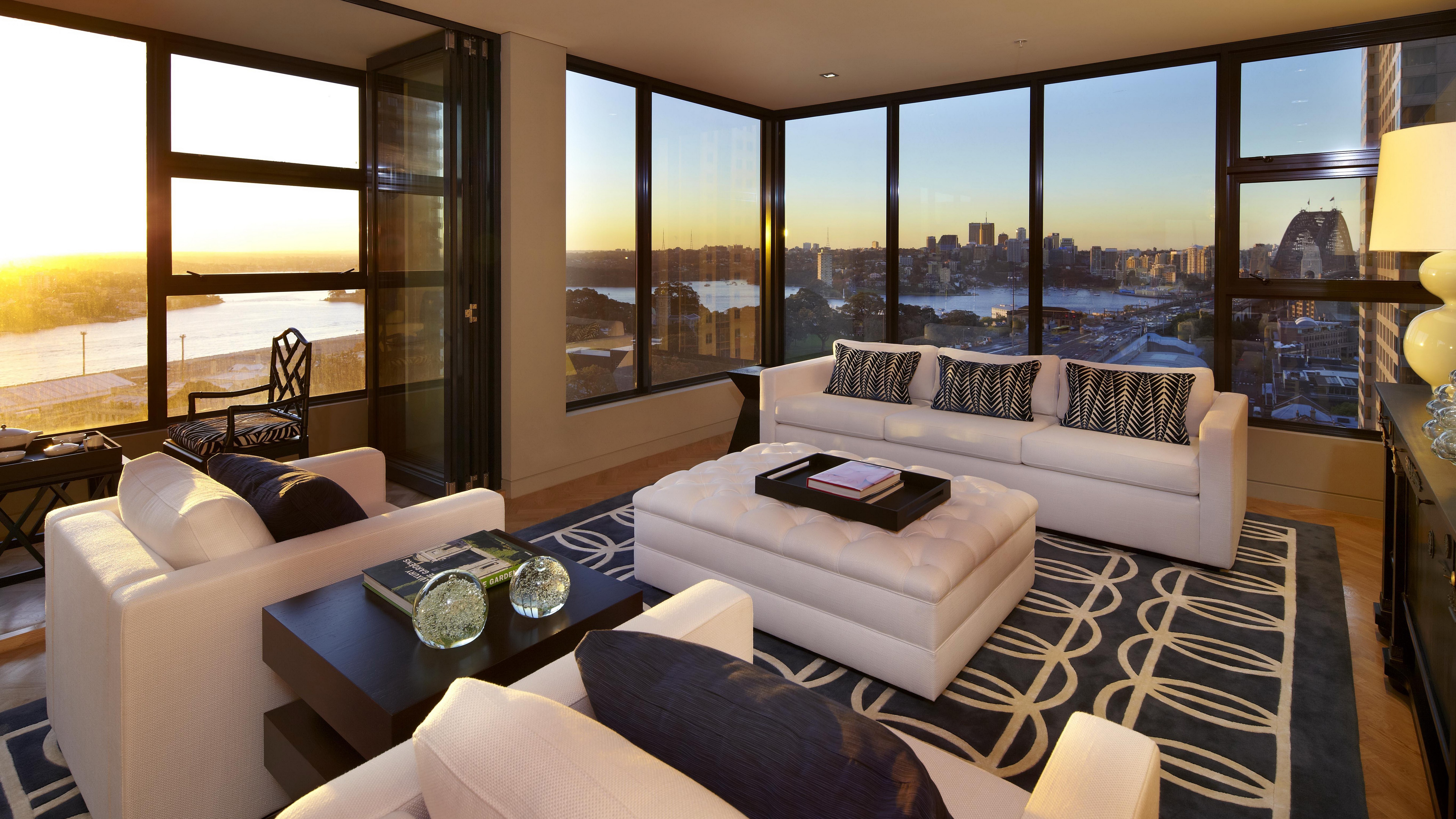 Living room with a view of Sydney Harbour at sunset HD Wallpaper