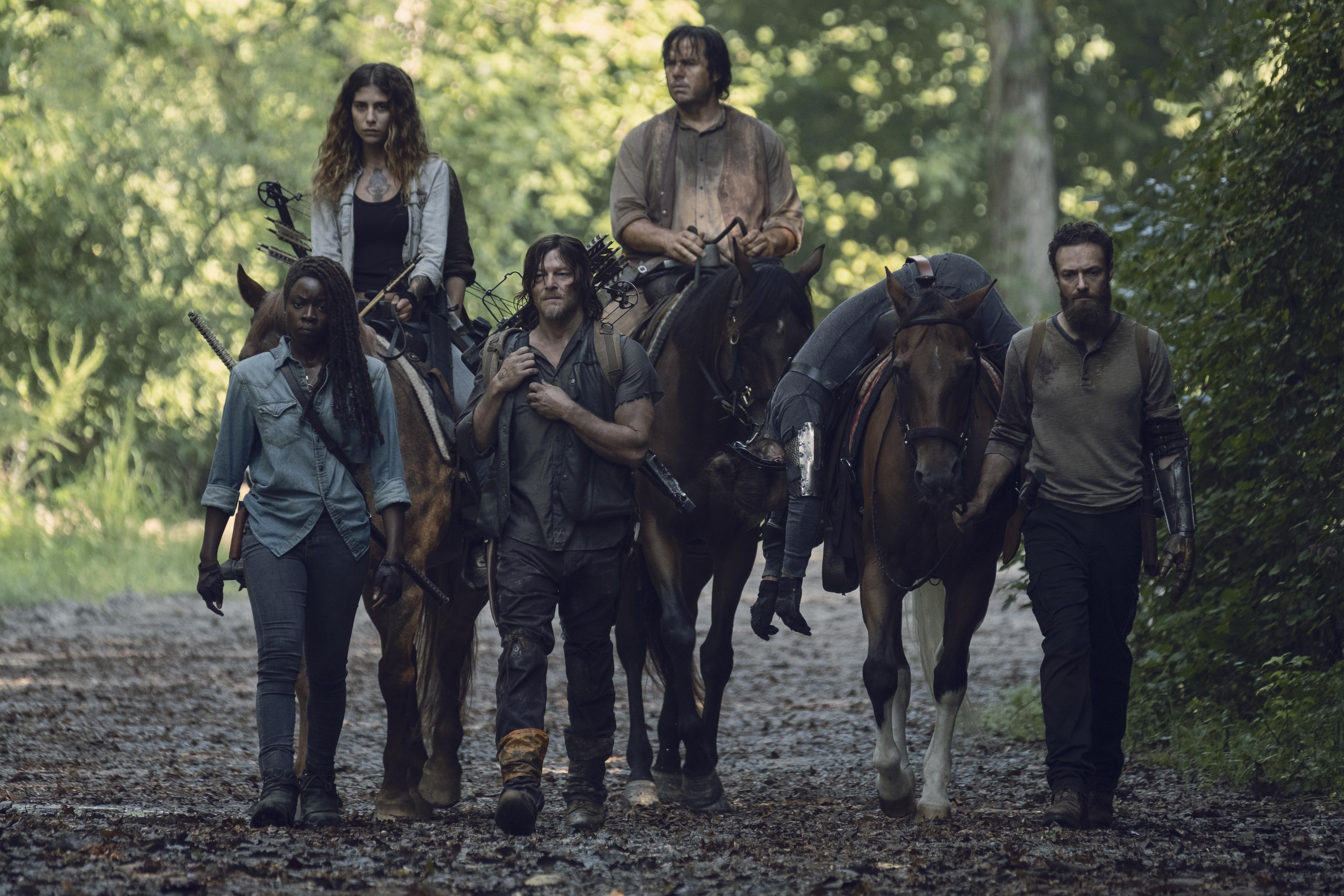Michonne and companions on horseback HD Wallpaper