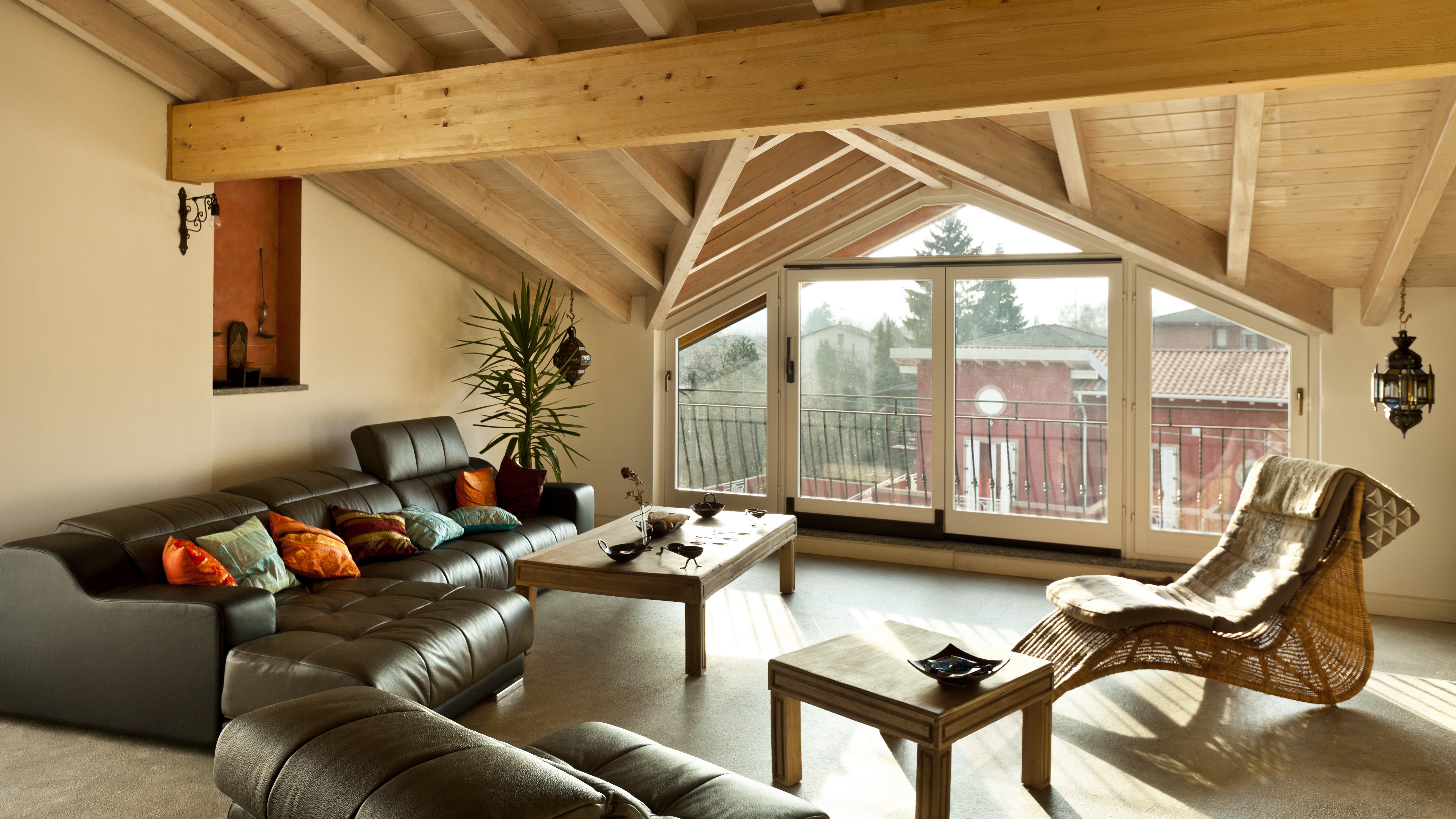 Attic living room with sectional sofa and large windows HD Wallpaper